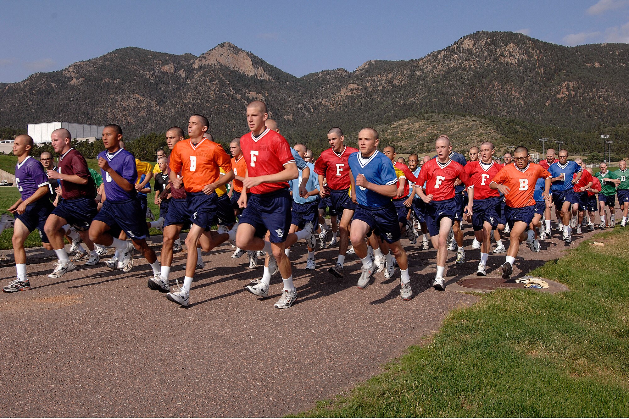 U.S. Air Force Academy basic cadet trainees take off at the start of a distance run during Field Day July 12 at the Academy's athletic fields in Colorado Springs, Colo.  After being greeted by Academy leaders, they competed in various athletic events, and closed out the morning with a parachute demonstration by the Academy's Wings of Blue parachute demonstration and competition team.  (U.S. Air Force photo/Rachel Boettcher)