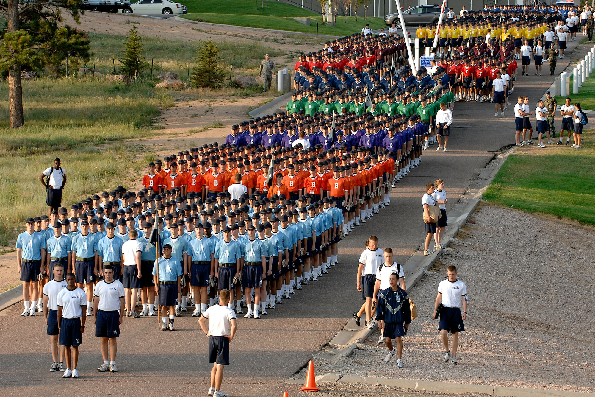 U.S. Air Force Academy basic cadet trainees of the Class of 2012 march to the athletic fields July 12 at the Academy in Colorado Springs, Colo., to test their teamwork and athletic skills during Field Day.  After being greeted by Academy leaders, they competed in various athletic events, and closed out the morning with a parachute demonstration by the Academy's Wings of Blue parachute demonstration and competition team.  (U.S. Air Force photo/Dave Ahlschwede)
