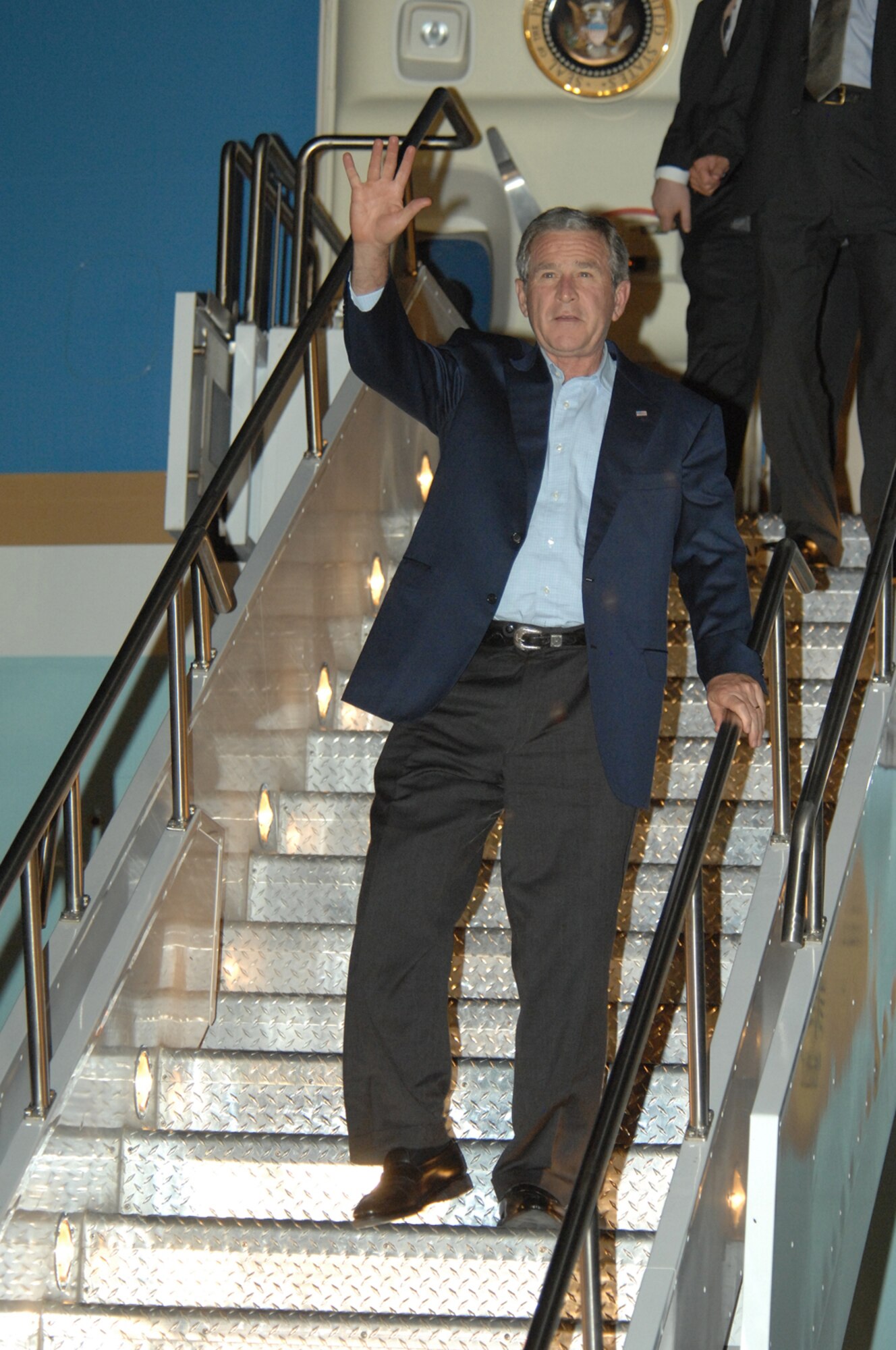 President George W. Bush arrives at Davis-Monthan Air Force Base, Ariz. July 17 to attend a VIP breakfast and to award Mary Frances Ward with the President's Volunteer Service Award for outstanding volunteer service in her community. President Bush has honored more than 650 volunteers since 2002. (U.S. Air Force photo by Airman 1st Class Noah R. Johnson)