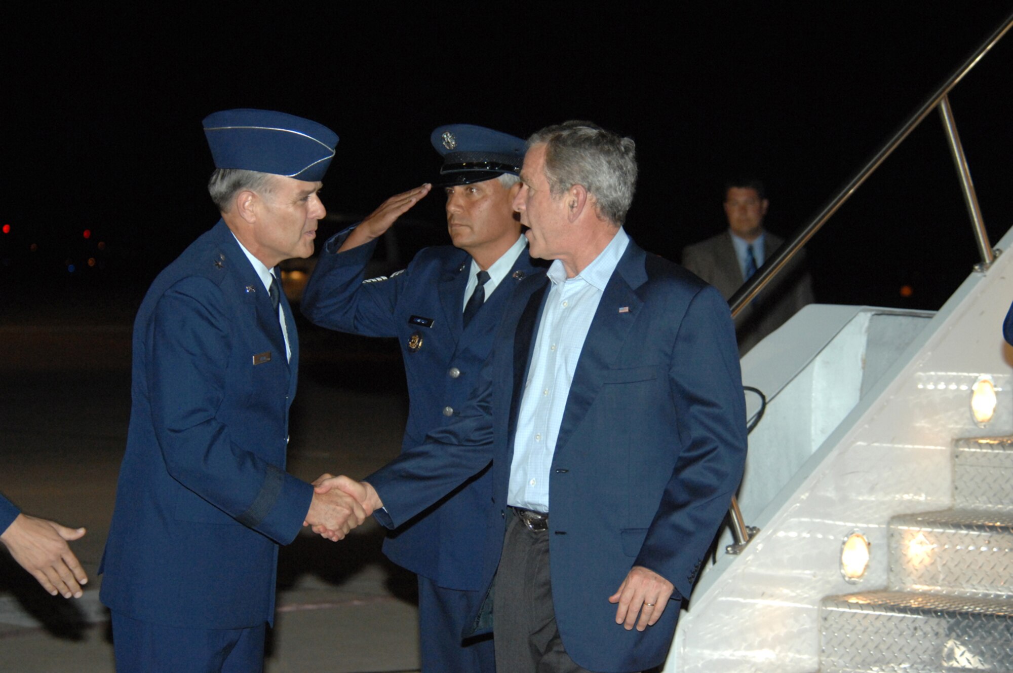 Brig. Gen. Joseph Mudd, 12th Air Force (Air Forces Southern) vice commander, greets President George W. Bush as he arrives at Davis-Monthan July 17. President Bush came to Tucson to attend a VIP breakfast a(U.S. Air Force photo by Airman 1st Class Noah R. Johnson)