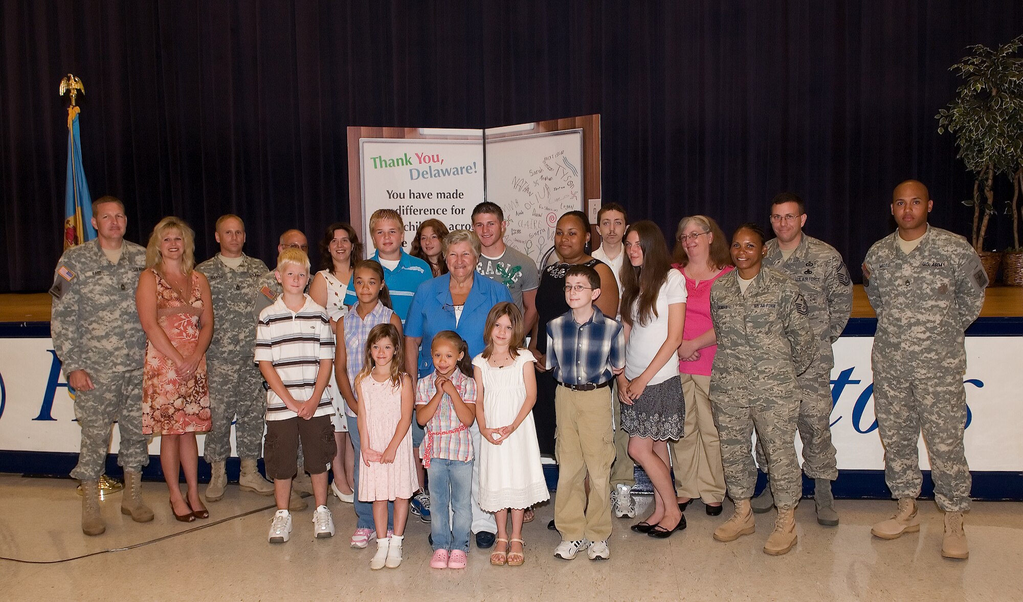 DOVER, Del. -- Servicemembers and their families gathered with Delaware officials at a ceremony for the signing of House Bill 297, the Compact for Education Transition for Military Children, at Dover High School Thursday. Delaware Governor Ruth Ann Minner signed the bill into law, making Delaware the tenth state to join the Compact, thus activating it and making educational transitions for active-duty military families easier amongst states participating in the Compact. (U.S. Air Force photo/Jason Minto)