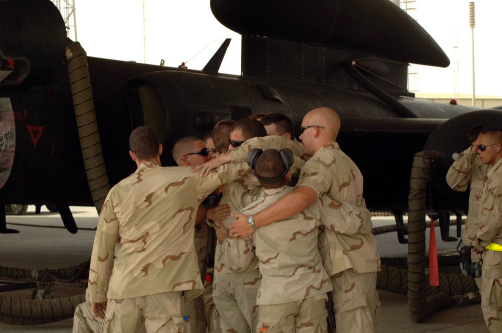 Airmen surround U-2 crew chief A1C Alexander Zwilling in front of an aircraft featuring chart artwork honoring his late brother, who was killed July 13, 2008, while serving with the Army in Afghanistan. 