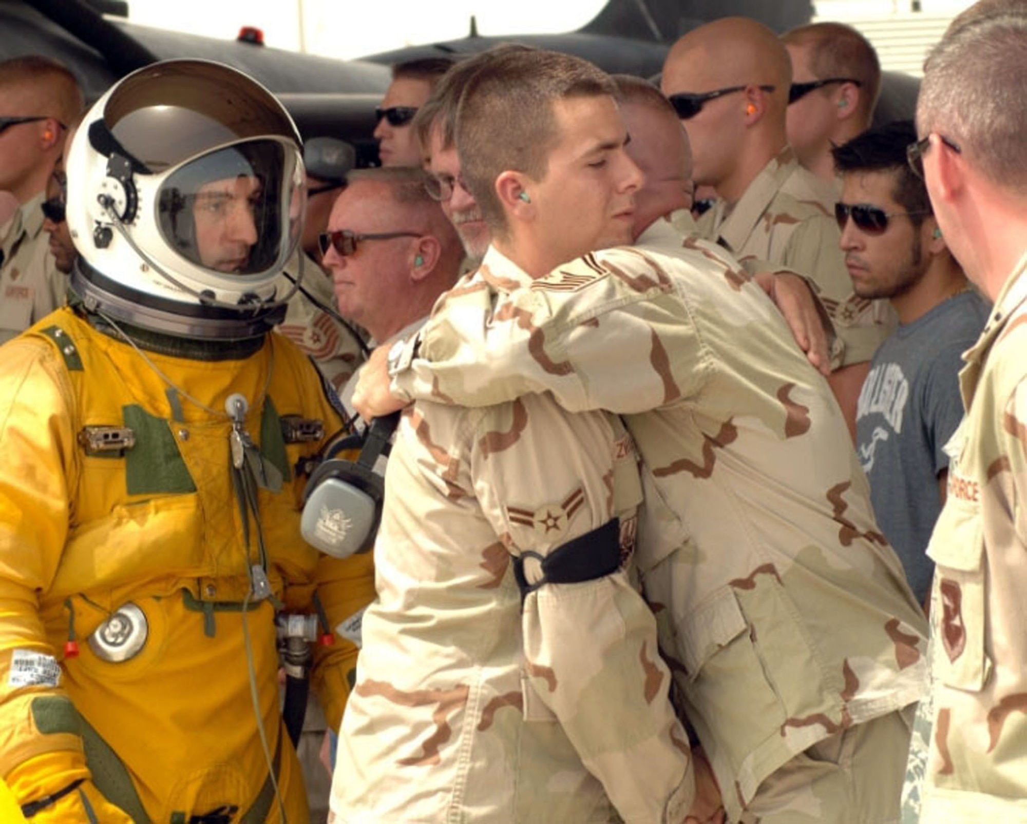 An Air Force senior master sergeant hugs A1C Alexander Zwilling, whose brother, Army Cpl. Gunnar W. Zwilling, was killed July 13, 2008, in Afghanistan.