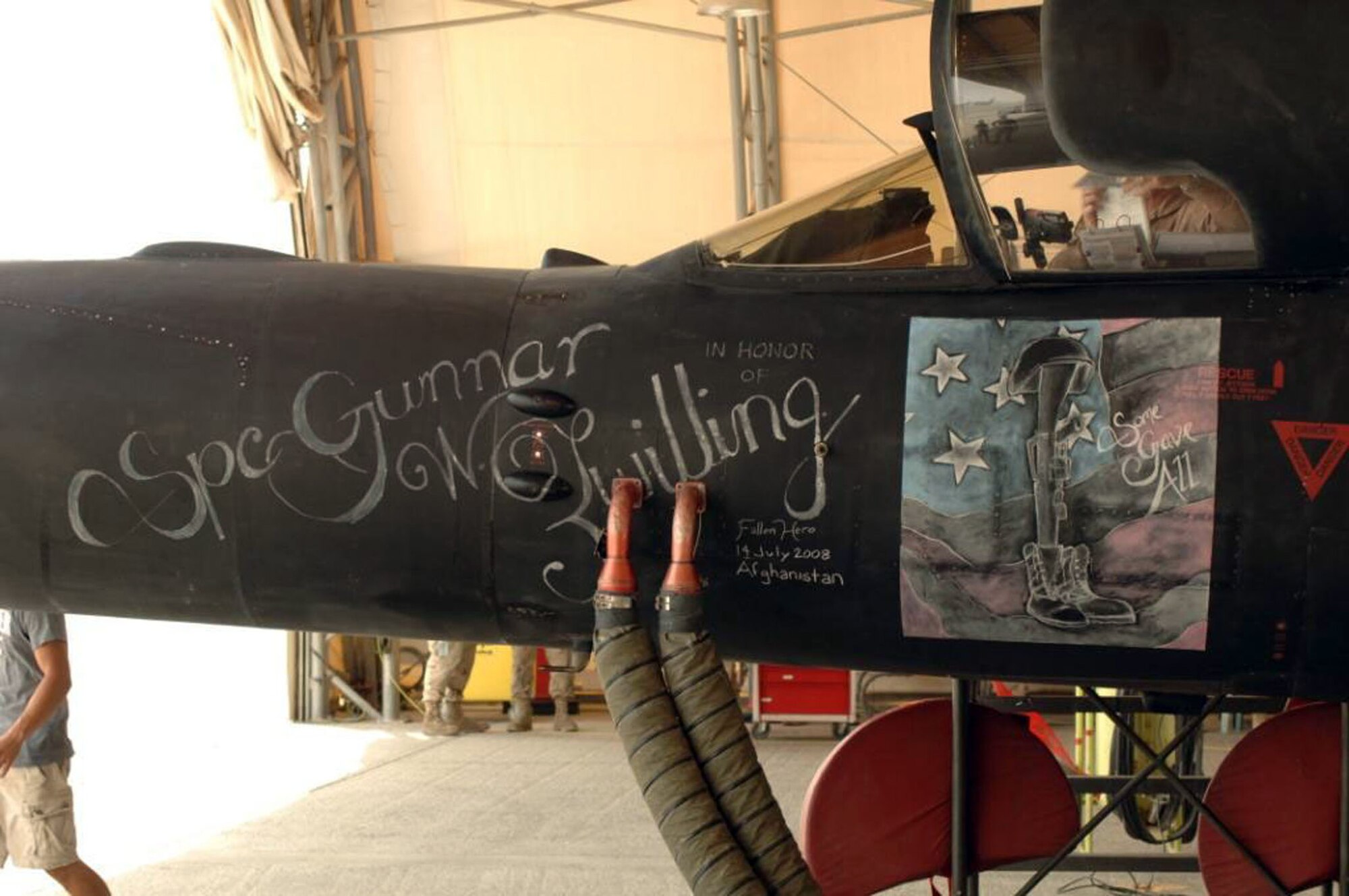 A U-2 features chalk art honoring the late brother of crew chief A1C Alexander Zwilling.