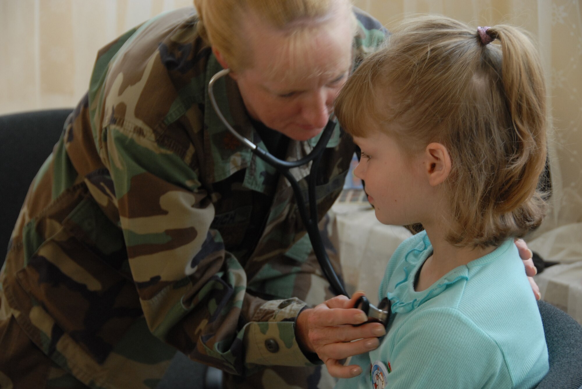 Major Laura Svinarich, 127th Medical Group physician assistant, deployed with 25 other Michigan Air National Guardsmen to Latvia in June as part of a medical support team that  visited the Priedite #2 Childrens center on June 17, 2008 in Daugavpils, Latvia.  