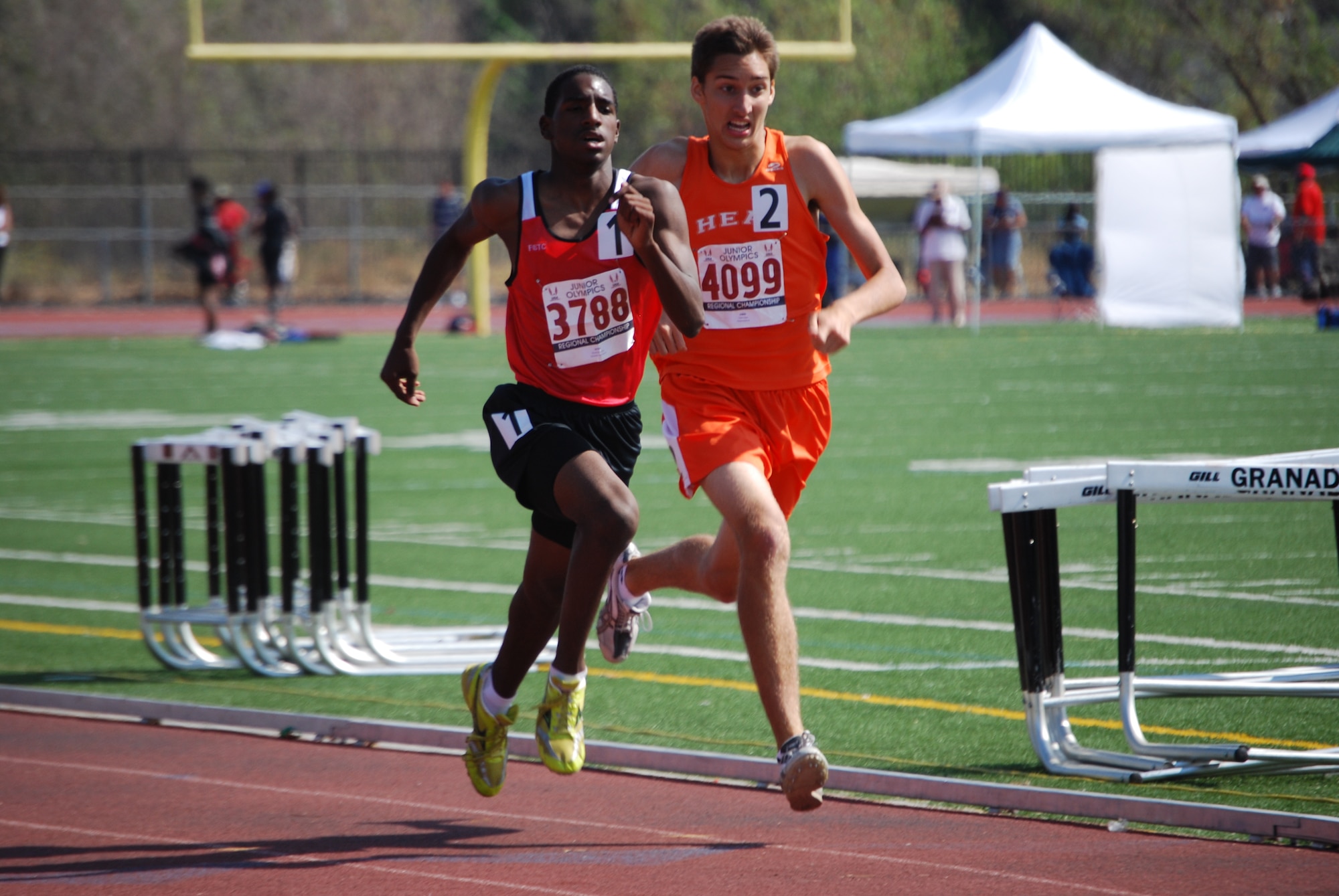 Kieren Broussard, left, competes in a recent track event. Broussard is the 16-year-old son of Senior Master Sgt. Donna Broussard, 349th Aeromedical Evacuation Squadron, and Greg, who founded and coaches the Full Stride Track Club. (Courtesy photo)