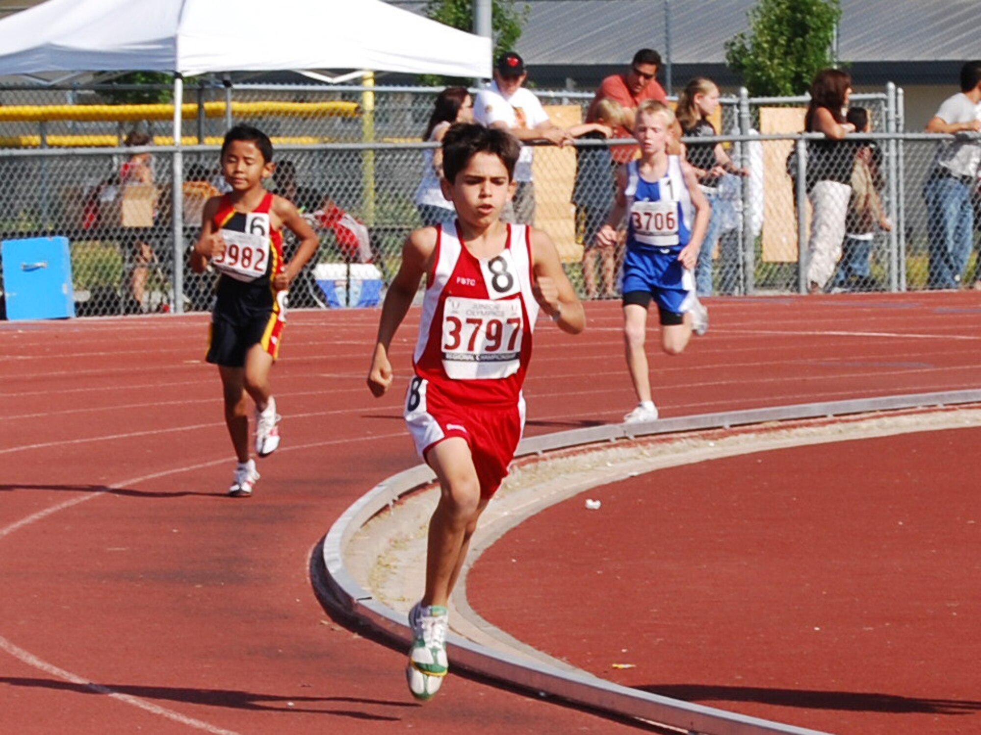 Brendan Myrick, center, competes in a recent track race. Myrick is one of seven children with ties to Travis who will compete in the Amateur Athletic Union Junior Olympics scheduled for July 23 through Aug. 2 in Detroit. (Courtesy photo)