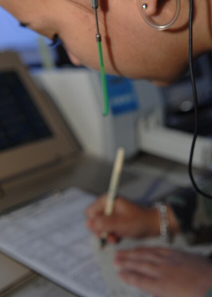DYESS AIR FORCE BASE, Texas -- Airman 1st Class Mazie Pualino, 7th Operations Support Squadron, logs in flight information in the Dyess Air Traffic Control TowerJuly 9. Recording this information ensures accountability and accuracy. (U.S. Air Force Photo by Airman 1st Class Stephen Reyes)