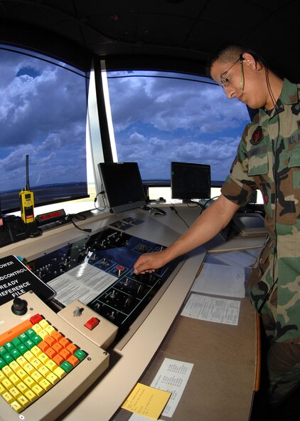 DYESS AIR FORCE BASE, Texas -- Senior Airman Gabriel Ramirez, 7th Operations Support Squadron, controls the flightline lighting at the air traffic control tower here, Jul. 9. The control tower not only controls what's in the air but also electrical equipment on the flightline. The 7th Operations Group has a vital role in completing the wing mission and ensuring the success of Team Dyess. (U.S. Air Force photo/Airman 1st Class Stephen Reyes)