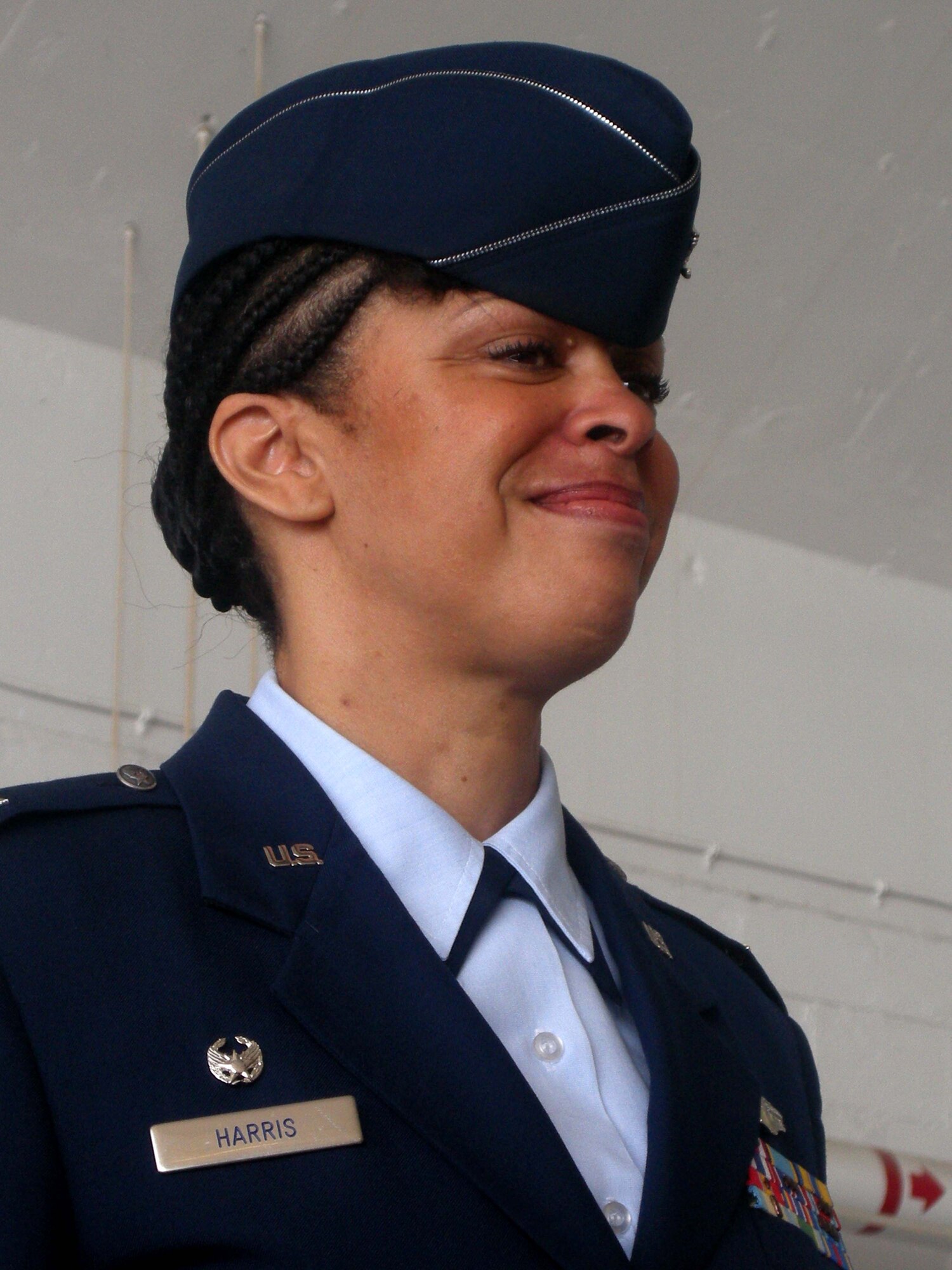 ANDREWS AIR FORCE BASE, Md. -- Col. Stayce D. Harris, 459th Air Refueling Wing commander, smiles emotionally as wing members render a final salute to her during the wing change of command ceremony here July 13. Colonel Harris handed the guidon to current Vice Commander and incoming Commander Col. Tim Cahoon, who assumes command Aug. 1. Colonel Harris moves on to become the Mobilization Assistant to the Director, Strategic Plans, Requirements and Programs, Headquarters Air Mobility Command, Scott Air Force Base, Ill. (U.S. Air Force photo/Tech. Sgt. Amaani Lyle)