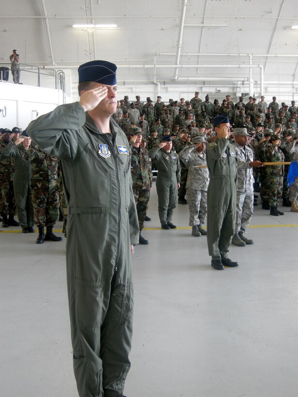 ANDREWS AIR FORCE BASE, Md. -- Col. Russell Muncy, 459th Operations Group commander, leads his units during a final salute at the 459th Air Refueling Wing change of command ceremony here July 13. Col. Stayce D. Harris, 459th ARW commander, handed the guidon to current Vice Commander and incoming Commander Col. Tim Cahoon, who assumes command Aug. 1. Colonel Harris moves on to become the Mobilization Assistant to the Director, Strategic Plans, Requirements and Programs, Headquarters Air Mobility Command, Scott Air Force Base, Ill. (U.S. Air Force photo/Tech. Sgt. Amaani Lyle)