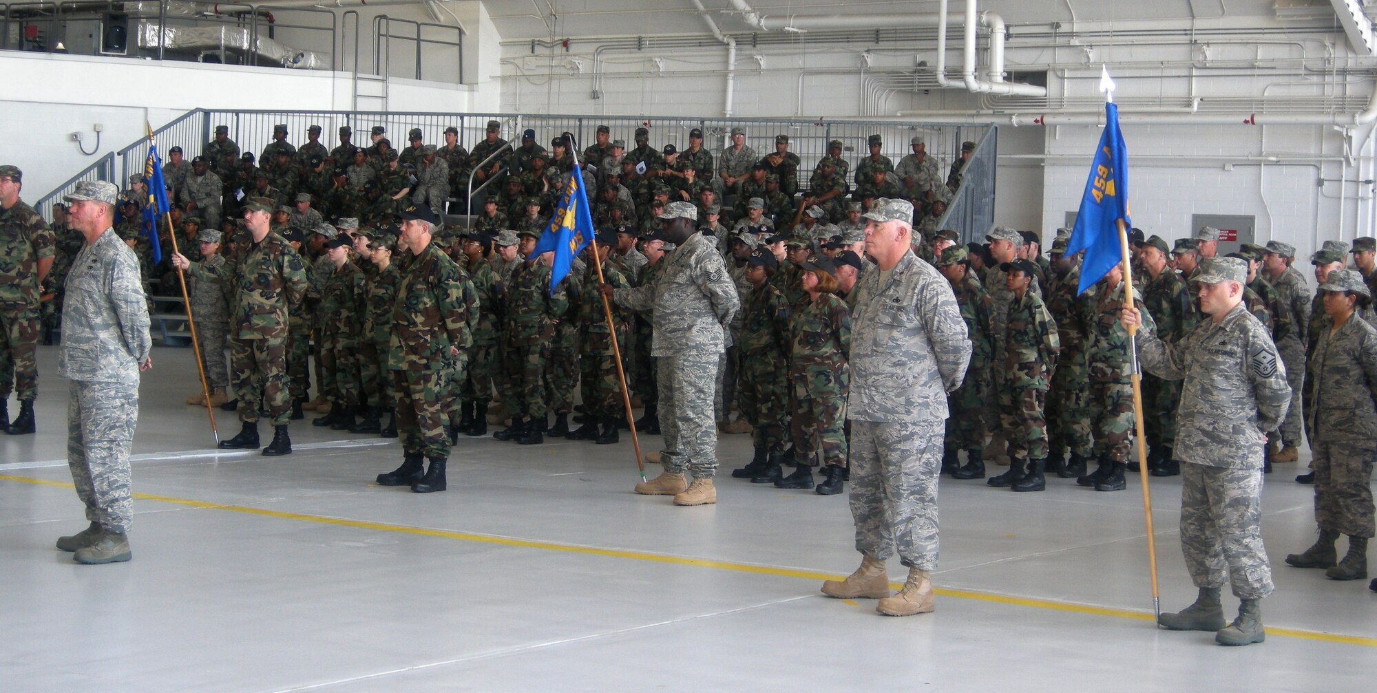 ANDREWS AIR FORCE BASE, Md. -- Members of the 459th Air Refueling Wing stand in formation during the wing change of command ceremony here July 13. Hundreds gathered as Col. Stayce Harris, 459th ARW commander, handed the guidon to current Vice Commander Col. Tim Cahoon, who officially assumes command Aug. 1. (U.S. Air Force photo/Tech. Sgt. Amaani Lyle)