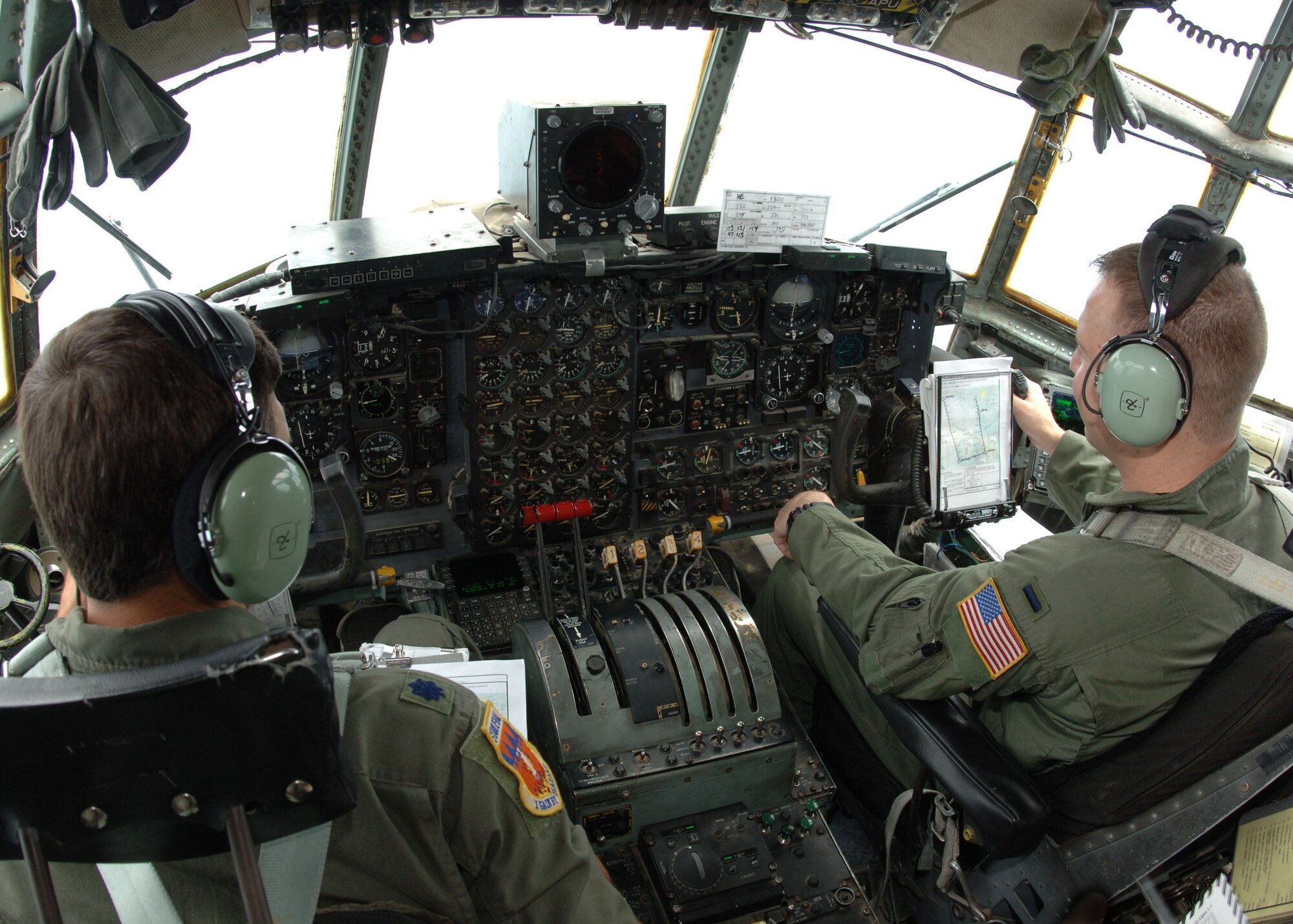 DYESS AIR FORCE BASE, Texas -- Lieutenant Col. Bret Crenwelge, alongside copPilot 1st Lt. William Bean, operates a Dyess C-130 Hercules during a 10-plane formation July 16. (U.S. Air Force Photo by Airman 1st Class Micheal Breaux)