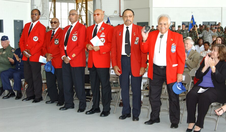 ANDREWS AIR FORCE BASE, Md. -- Original Tuskegee Airmen stand for applause at the 459th Air Refueling Wing change of command ceremony here July 13. Col. Stayce Harris handed the guidon to current Vice Commander and incoming Commander Col. Tim Cahoon, who officially assumes command Aug. 1. (U.S. Air Force photo/Master Sgt. Shayne Sewell)