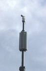 7/4/2008 - The mass mobile camera, which resembles those seen at stop lights, can monitor crowds, while the speaker system emits messages. (USAF photo by Alan Boedeker)                              