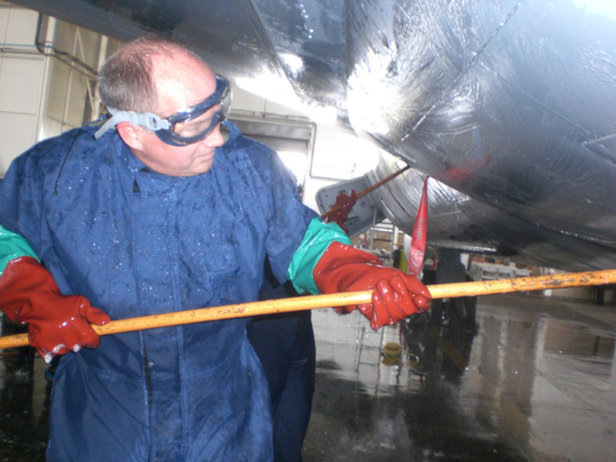 RAF MILDENHALL, England -- Lt. Col. Rich Wagner, 100th Force Support Squadron commander, washes a KC-135 Stratotanker July 14 as part of a fundraiser to benefit the Air Force Ball in September. (U.S. Air Force photo by Breane Lyga)