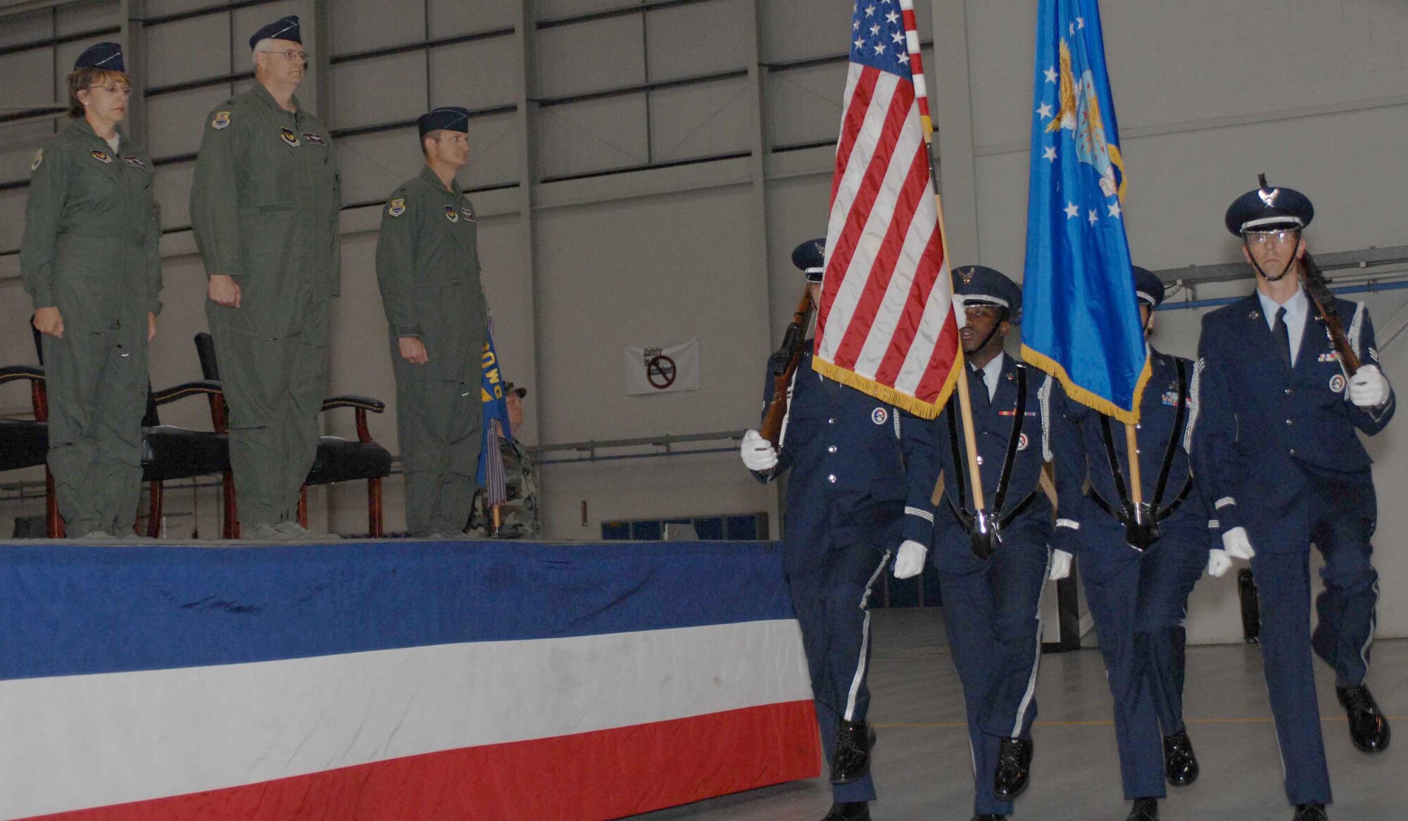 RAF MILDENHALL, England -- (from left to right) Col. Eden Murrie , 100th Air Refueling Wing commander, conducts the 100th Operations Group change of command ceremony July 17 from Col. J.D. Clifton to Col. Creg Paulk. Colonel Paulk joins RAF Mildenhall from Cheyenne Mountain Air Force Station, Colo. (U.S. Air Force photo by Airman 1st Class Brad Smith)