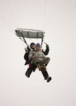 7/9/2008 - Master Sgt. Timothy Kane, 37th Security Forces Squadron, arrives at his retirement ceremony July 9 with some help from Staff Sgt. Nicholas Seibel, 342nd Training Squadron. For his retirement, Sergeant Kane did a tandem jump with Sergeant Seibel, landing at the basic military training parade grounds. (USAF photo by Robbin Cresswell) 