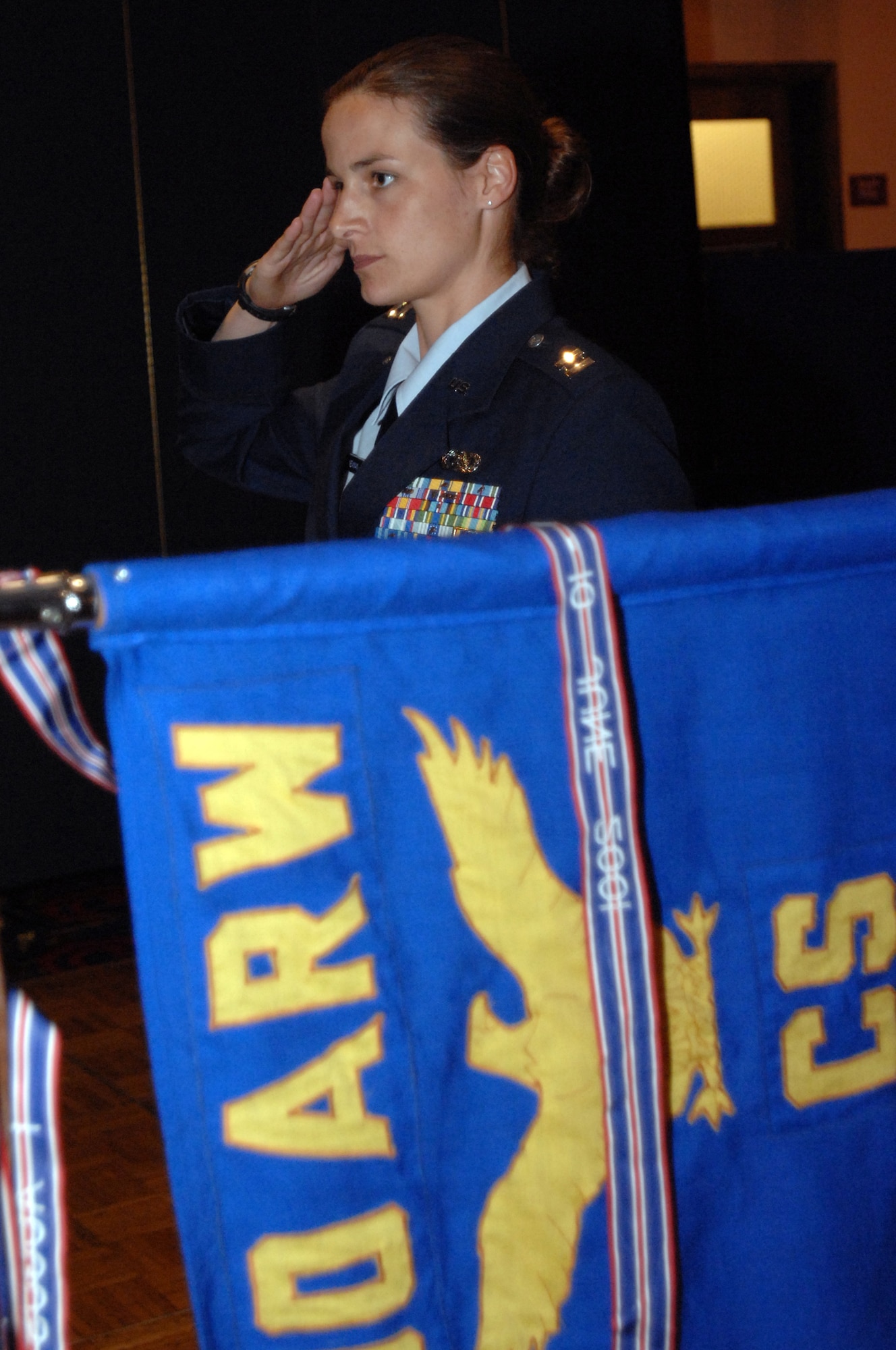 RAF MILDENHALL, England -- Capt. Deborah Newman, 100th Communications Squadron deputy commander, renders a salute during the posting of the colors at the squadron's change of command ceremony July 17. Lt. Col. David Stookey, who recently returned from a 1-year tour in Southwest Asia, assumed command from Lt. Col. Karl Kraan, who is leaving RAF Mildenhall for a new assignment at the Pentagon. (U.S. Air Force photo by Senior Airman Teresa M. Hawkins)
