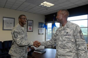 Chief Master Sgt. James E. David, 316th Wing command chief master sergeant, is welcomed to Andrews AFB by Chief Master Sgt. Louis Monroe, Air Force District of Washington command chief master sergeant on July 14.