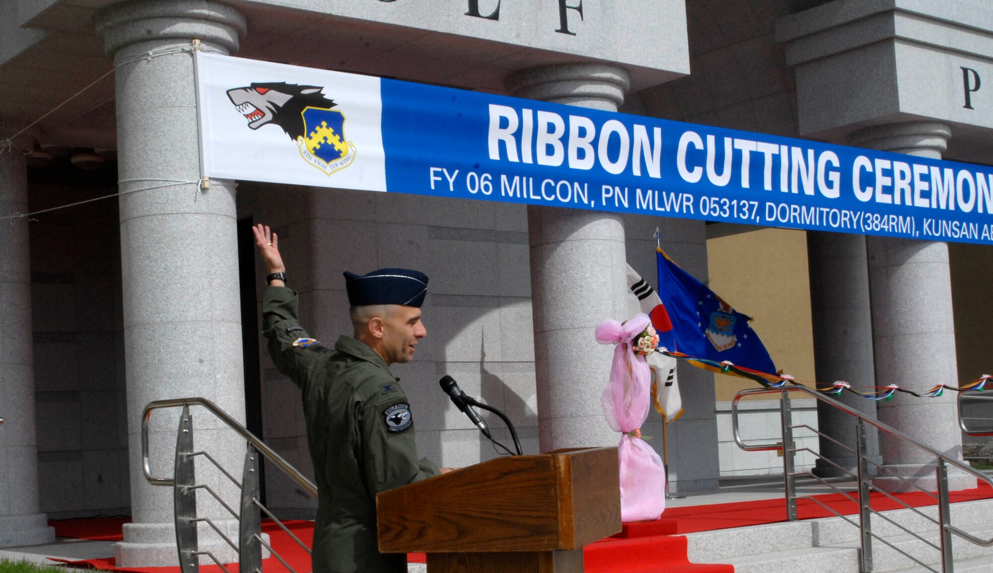 KUNSAN AIR BASE, Republic of Korea--Colonel Bryan "Wolf" Bearden, 8th Fighter Wing commander, gives opening remarks during the ribbon cutting ceremony for a new dormitory here July 16. The ceremony dedicates the completion of the Wolf Pack's new FY06 tower dormitory. The project is part of the Air Force's initiative to improve the quality of life for Airmen. (U.S. Air Force photo by Senior Airman Dana Hill)