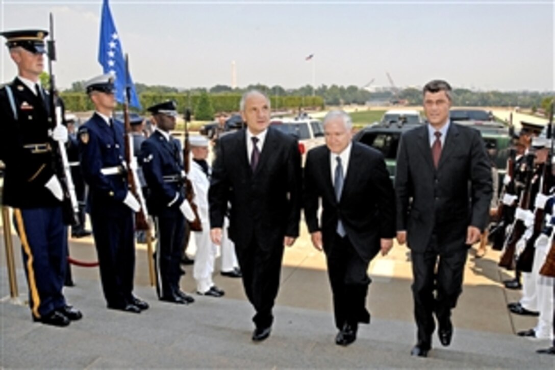 U.S. Defense Secretary Robert M. Gates, center, escorts visiting President Fatmir Sejdiu, left, and Prime Minister Hashim Thaci, of the newly independent nation of Kosovo, into the Pentagon on July 18, 2008. Gates and his senior advisors will meet with the Kosovar leadership to discuss the new nation's security requirements.  