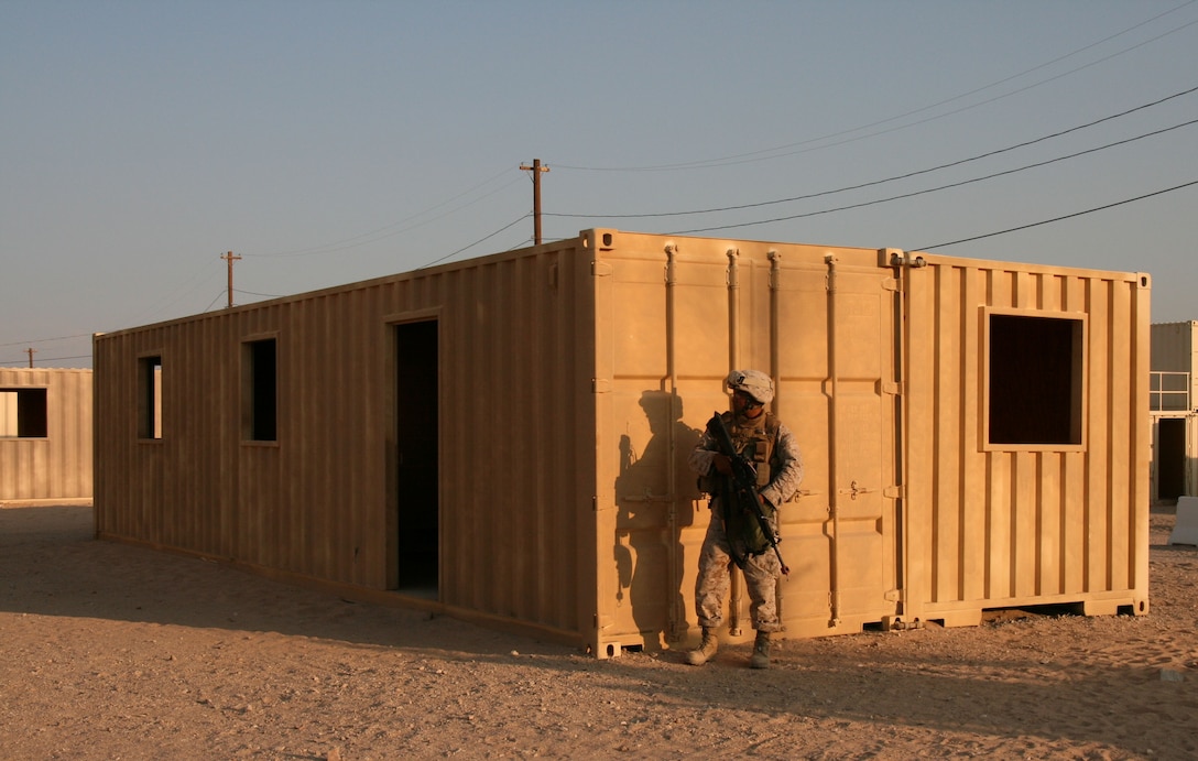 Pfc. Mario Zamora, a Reserve Marine with Weapons Company, 2/25, provides security for his mobile assault team in “Wadi Al Sahara,” an urban training facility at Marine Corps Air Ground Combat Center in Twentynine Palms, Calif. on July 18, 2008.  Weapons Company was assigned as the quick reactionary force for the battalion during the pre-deployment training exercise.  The unit is bound for Iraq in the fall.