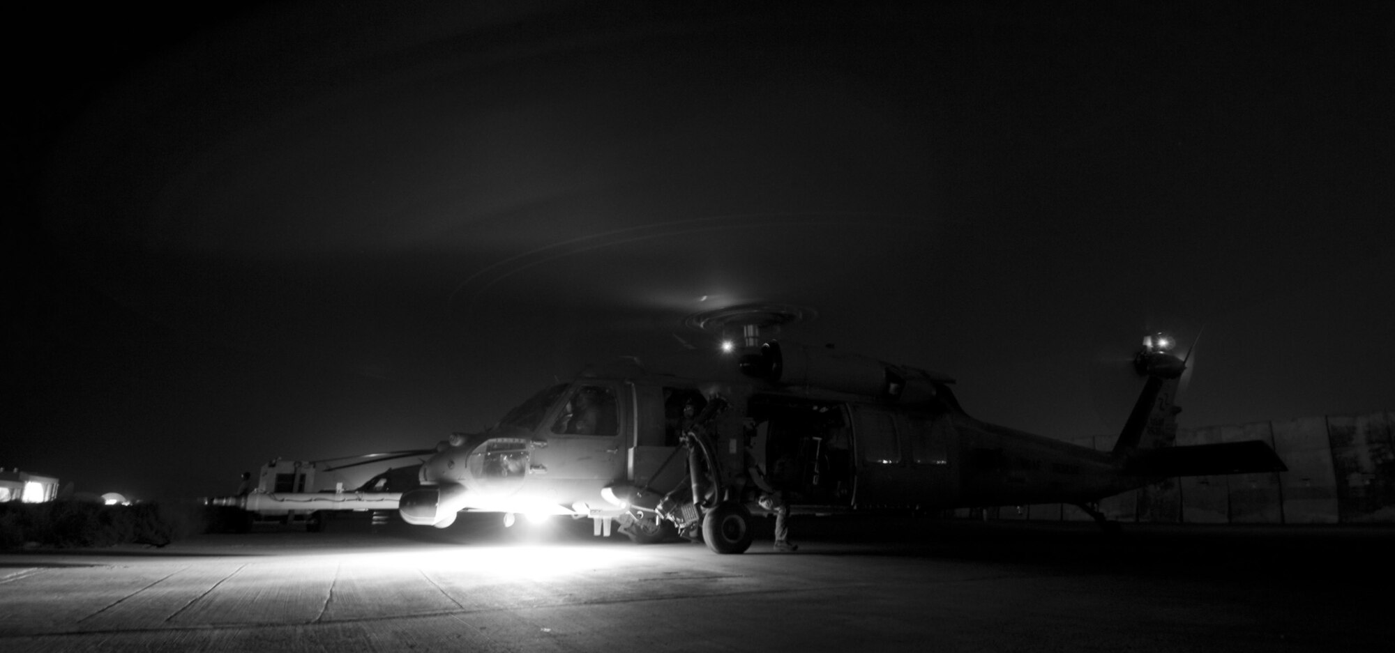 BAGRAM AIR FIELD, Afghanistan -- An HH-60 Pave Hawk spins up it's rotors for takeoff here on July 17, 2008. All HH-60Gs have night vision goggles with lighting and a forward looking infrared system that make this airframe ideal for performing medical evacuation missions in adverse conditions, even under a new moon. (U.S. Air Force photo by Staff Sgt. Samuel Morse)