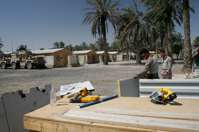 FALLUJAH, Iraq (July 20, 2008) –Marines of Company L, 3rd Battalion, 6th Marines make storage boxes with extra building material, July 20. The company rebuilt their compound after a fire destroyed it June 25 at Entry Control Point-5 (ECP-5), a post where Marines and Iraqi Police control traffic and safeguard entrants into the city of Fallujah. The company received an outpouring of support from people back home, neighboring units and local Iraqis. (Official U.S. Marine Corps photo by Cpl. Chris Lyttle) (RELEASED)