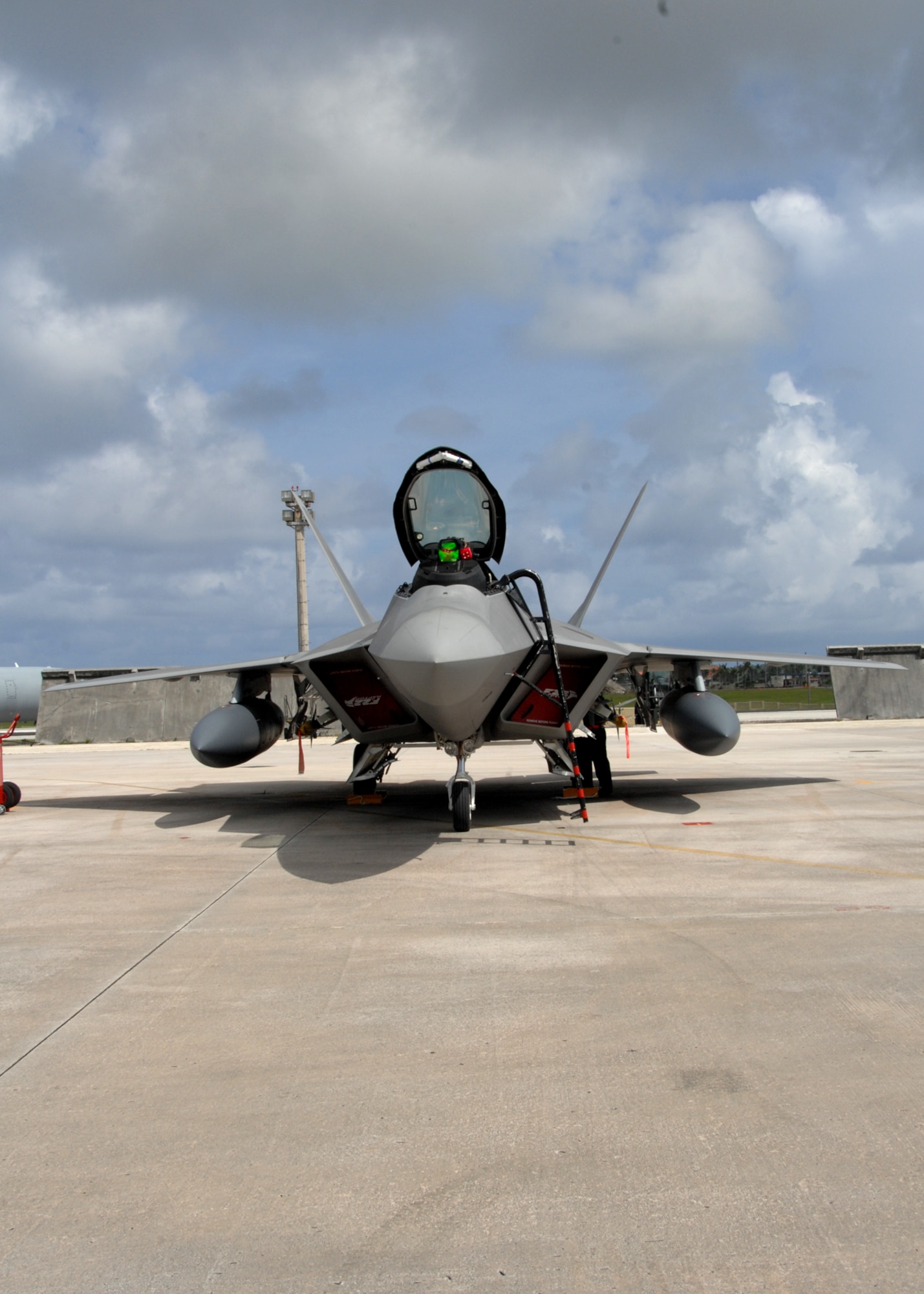 A U.S. Air Force F-22A Raptor sits on the flightline after landing at Andersen Air Force Base, Guam July 20. This is the second time that F-22A's have been to Guam. Five Raptors and associated support personnel assigned to the 90th Expeditionary Fighter Squadron Elmendorf Air Force Base, Alaska are here to participate in the Jungle Shield exercise and conduct Cope Thaw training . (U.S. Air Force by Airman 1st Class Nichelle Griffiths)
