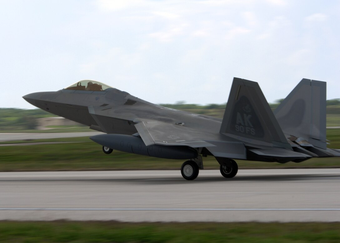A U.S. Air Force F-22A Raptor lands at Andersen Air Force Base, Guam July 20. Five Raptors and associated support personnel assigned to the 90th Expeditionary Fighter Squadron Elmendorf Air Force Base, Alaska are here to participate in the Jungle Shield exercise and conduct Cope Thaw training .  (U.S. Air Force by Airman 1st Class Nichelle Griffiths)