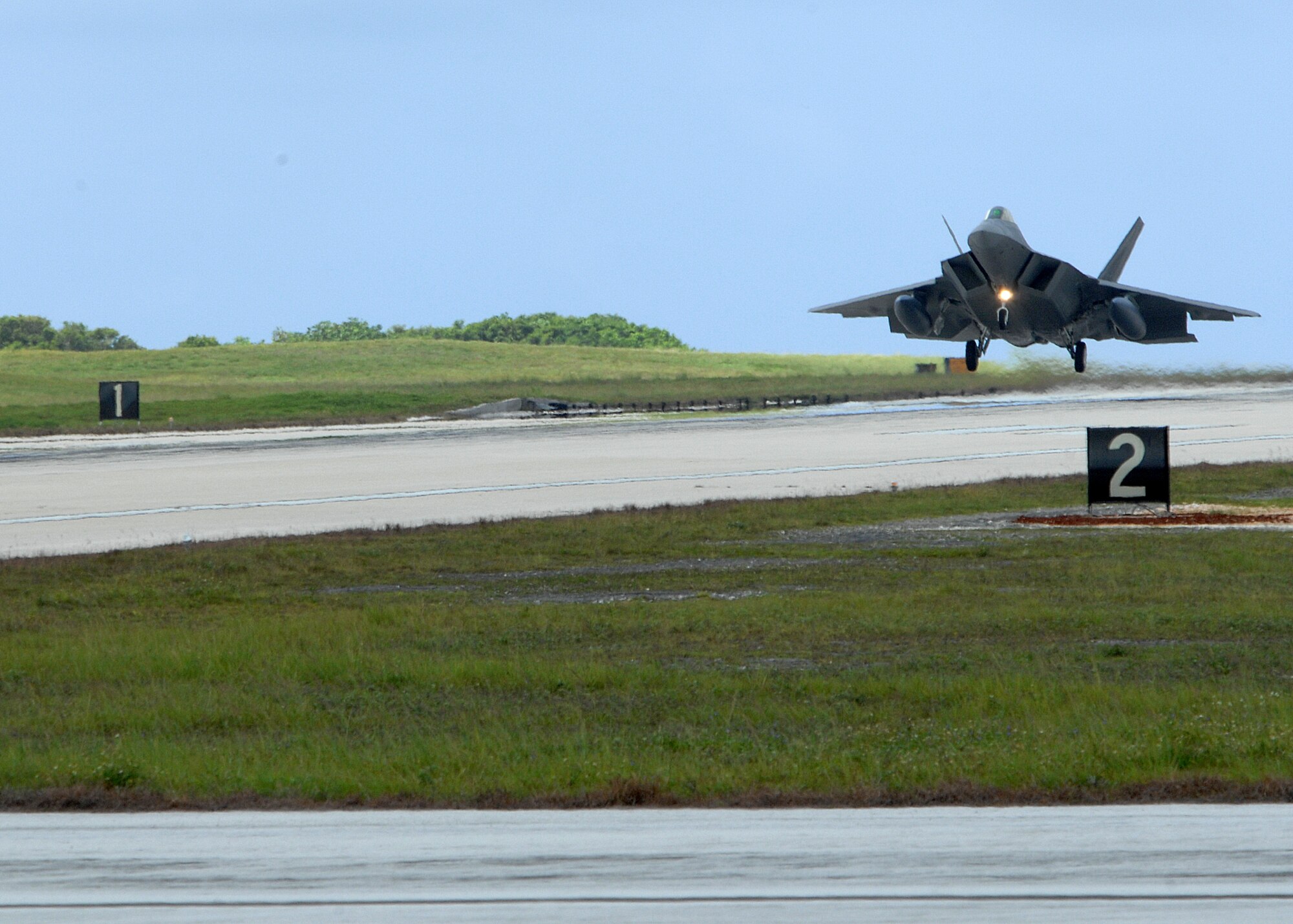 A  U.S. Air Force F-22A Raptors arrives at Andersen Air Force Base, Guam July 20. The F-22A Raptor is newest Air Force fighter aircraft.  Five Raptors and associated support personnel assigned to the 90th Expeditionary Fighter Squadron Elmendorf Air Force Base, Alaska are here to participate in the Jungle Shield exercise and conduct Cope Thaw training .   (U.S. Air Force by Airman 1st Class Nichelle Griffiths)