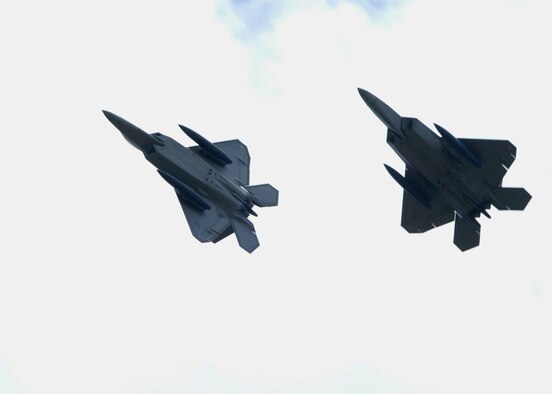 U.S. Air Force F-22A Raptors fly high above Andersen Air Force Base, Guam July 20. Although this is the second time that F-22A's have been deployed to Guam, this is the first time F-22A’s assigned to the 90th Expeditionary Fighter Squadron Elmendorf Air Force Base, Alaska have come here. The F-22 Raptor is newest Air Force fighter aircraft. (U.S. Air Force by Airman 1st Class Nichelle Griffiths)
