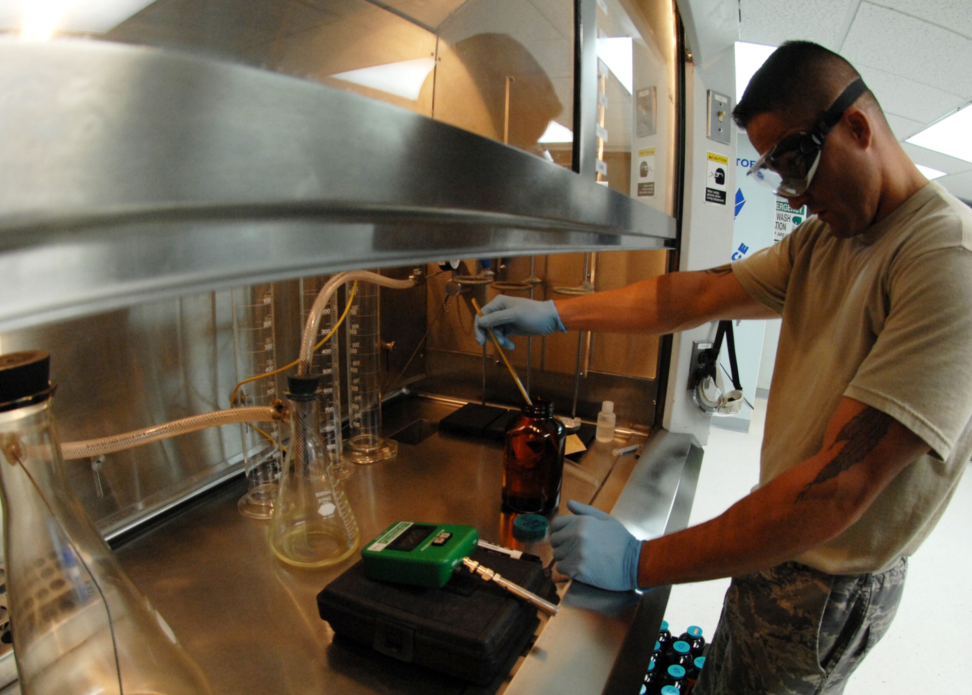 ANDERSEN AIR FORCE BASE, Guam-Tech. Sgt. Dan Rabideau of the 36th Logistics Readiness Squadron Fuels Laboratory, tests samples of jet fuel before allowing the fuel to reach aircraft on the flight line here, July 14. All fuel received is sampled and tested to ensure it meets all standards. (U.S. Air Force by Airman 1st Class Nichelle Griffiths) 
