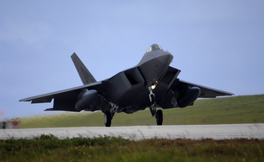 A U.S. Air Force F-22A Raptor assigned to the 90th Expeditionary Fighter Squadron out of Elmendorf Air Force Base, Alaska lands at Andersen Air Force Base, Guam July 20. The F-22A Raptor is the Air Force's newest fighter aircraft. Its combination of stealth, supercruise, maneuverability, and integrated avionics, coupled with improved supportability, represents an exponential leap in warfighting capabilities. The Raptor performs both air-to-air and air-to-ground missions allowing full realization of operational concepts vital to the 21st century Air Force.  (U.S. Air Force by Airman 1st Class Courtney Witt)