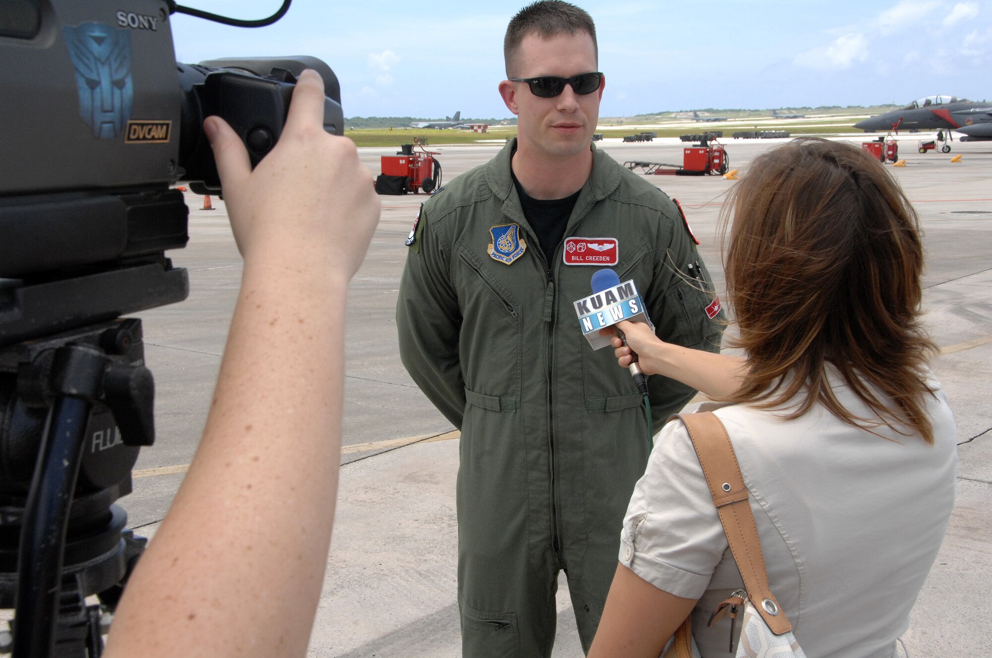 Ronna Sweeney from KUAM news interviews Capt. Bill Creeden on Andersen Air Force Base Guam July 20. The Capt. Is assigned to the 90th Expeditionary Fighter Squadron which is deployed here from Elmendorf Air Force Base, Alaska to participate in the Jungle Shield exercise and conduct Cope Thaw training. (U.S. Air Force by Airman 1st Class Courtney Witt)