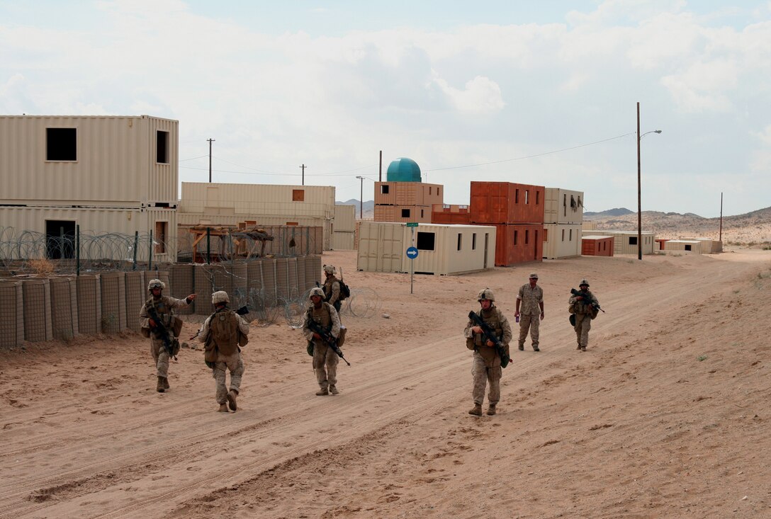 A squad patrol from Company G, 2nd Battalion, 25th Marine Regiment patrols the streets of Twentynine Palms' "Wadi Al Sahara" training facility July 20, 2008.