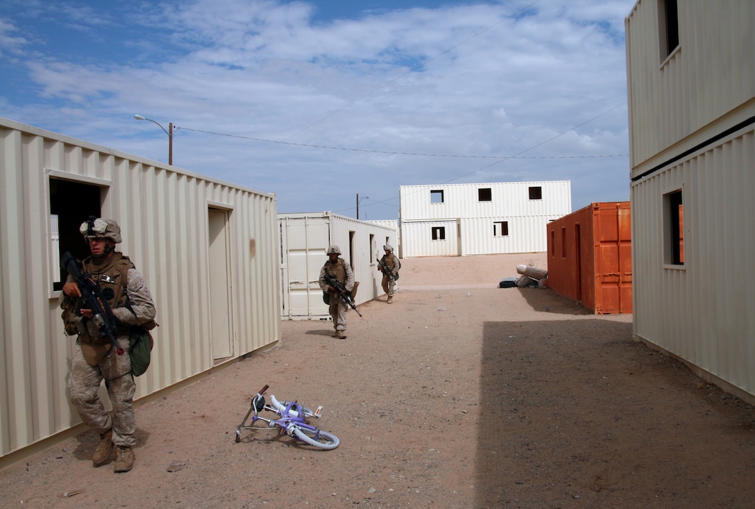 A squad patrol from Company G, 2nd Battalion, 25th Marine Regiment patrols the streets of Wadi Al Sahara urban warfare training facility here July 20, 2008.  The Marines of 2/25 are headed for Iraq in the fall.  This is the reserve battalion's third mobilization and second deployment since 2002.