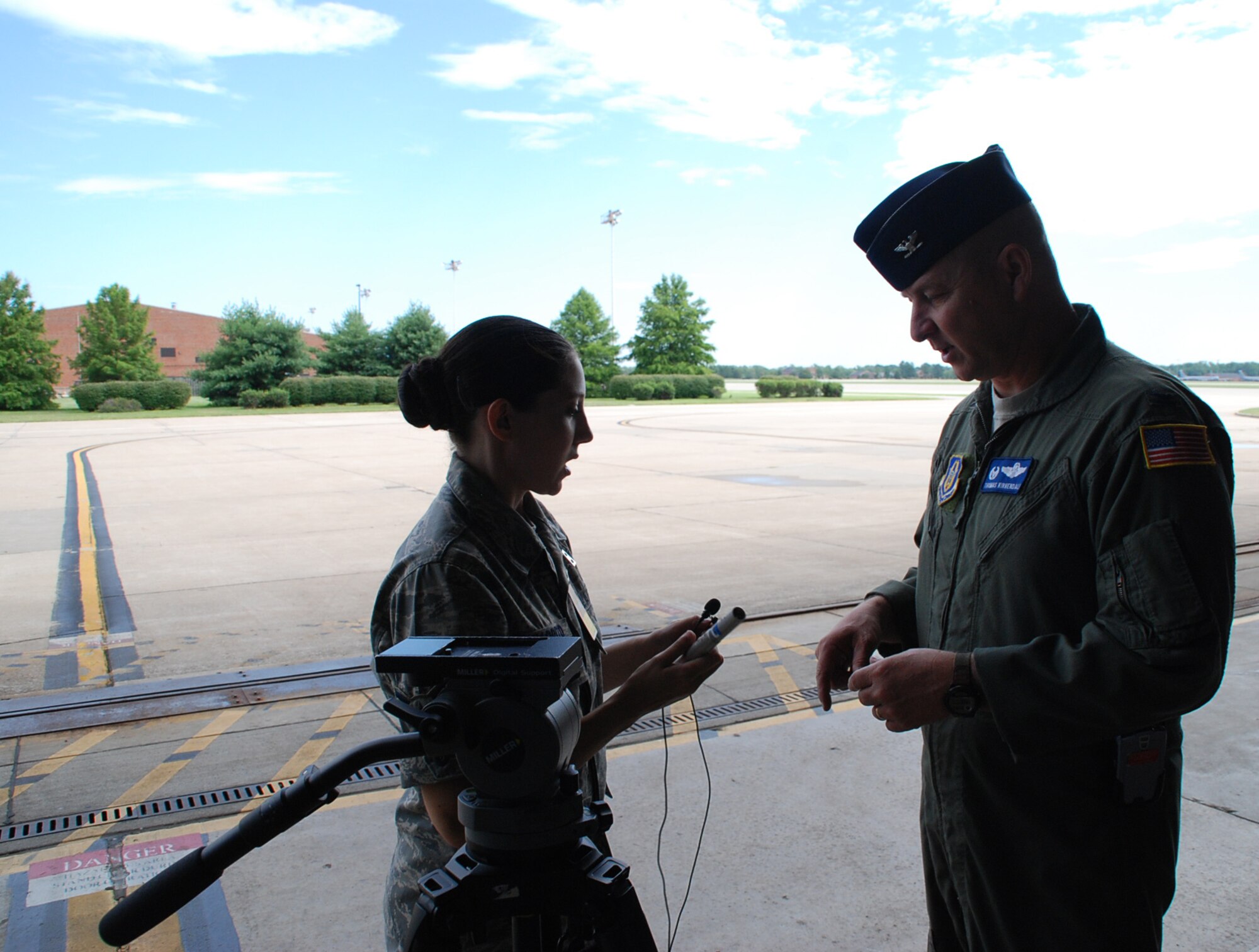 The commander of the 932nd Airlift Wing's Operations Group, Col. Thomas Kirkendall, get miked up in preparation for an interview.  He spoke with pride about his favorite memories of 2007 during the filming of a documentary.  He talked about pride in the men and women who took on three brand new C-40C aircraft during the year, and opportunities for airmen to become flight attendants.  Photo/Maj. Stan Paregien