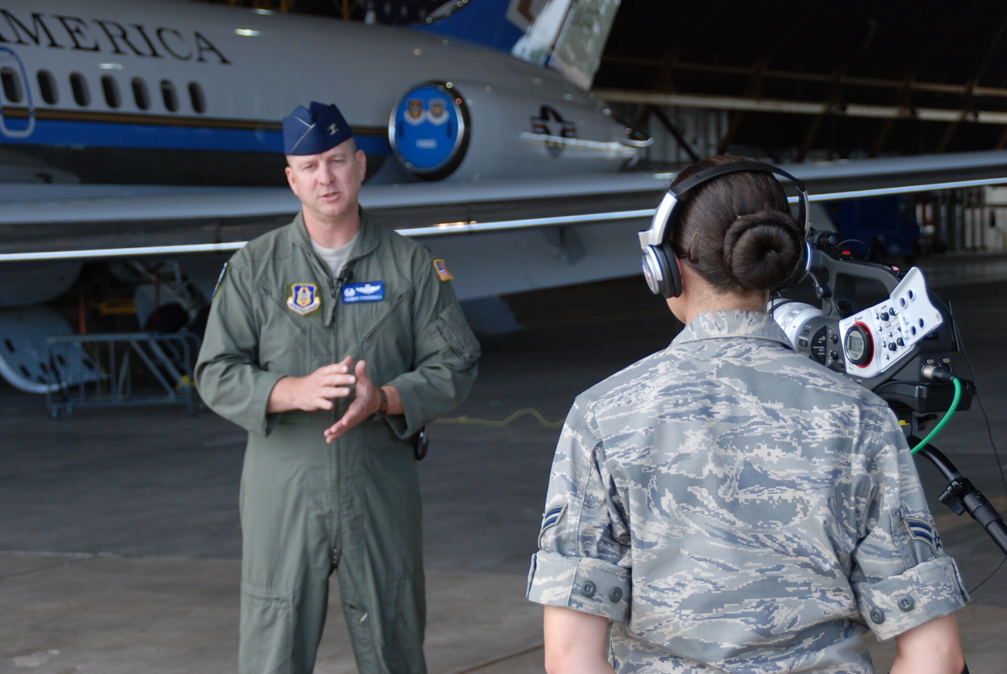 Movie star in the making?  The commander of the 932nd Airlift Wing's Operations Group, Col. Thomas Kirkendall, gets miked up in preparation for an interview.  He spoke with pride about his favorite memories of 2007 during the filming of a documentary.  He talked about how members of the wing took on three brand new C-40C aircraft during the year, and about opportunities for airmen to become flight attendants.  Photo/Maj. Stan Paregien
