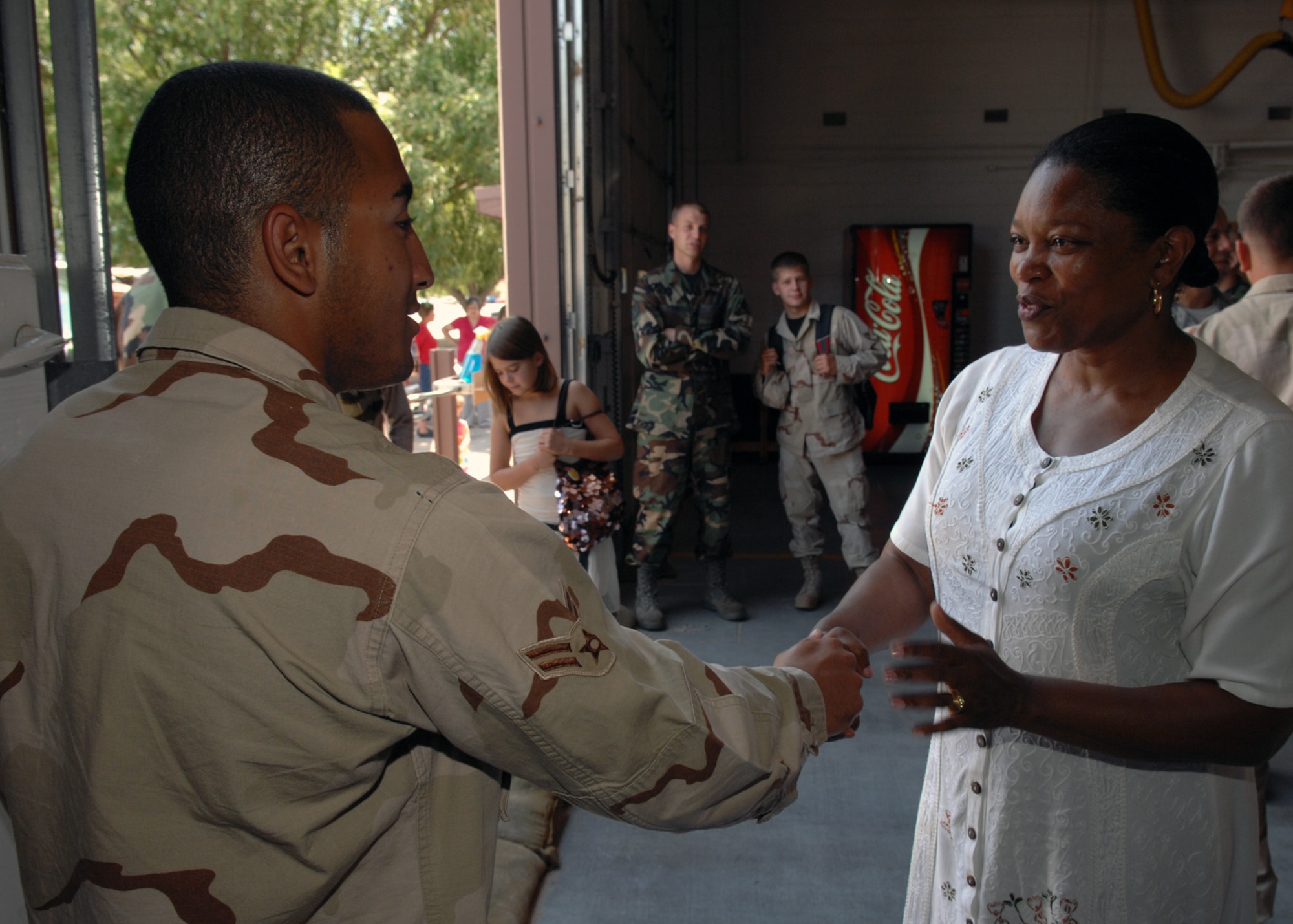 Airman 1st Class Gianno Nogueras is greeted by family and friends on July 19 Holloman Air Force Base, N.M. Airman Nogueras was one of five firefighters to return from a four month deployment to Manas Air Base. 

(U.S. Air Force photo/Senior Airman Anthony Nelson Jr)
