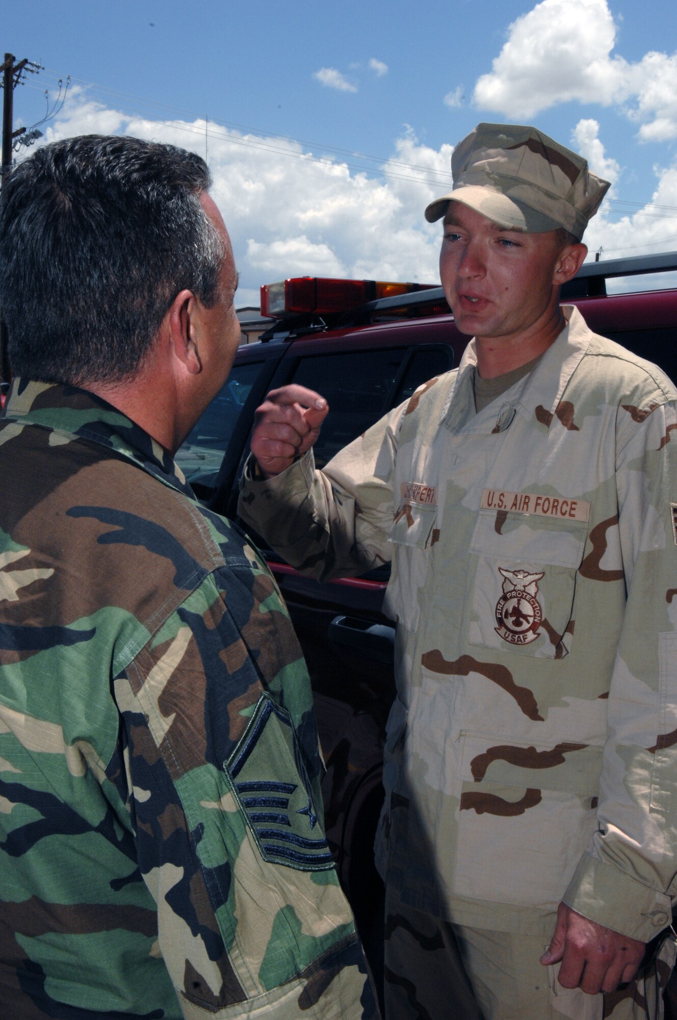 Staff Sgt. Chad Schumpert is greeted by Master Sgt. James Lindsey on July 19 Holloman Air Force Base, N.M. Sgt Schumpert and five other firefighters return from a four month deployment to Manas Air Base. 

(U.S. Air Force photo/Senior Airman Anthony Nelson Jr)
