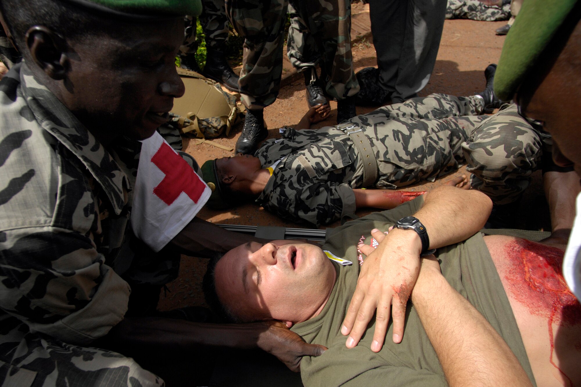 BAMAKO, Mali -- Malian medical personnel prepare to move U.S. Navy HM3 Scott Ott from a simulated mass casualty accident during MEDFLAG 08, July 18, 2008 in the village of Kati.  More than 90 servicemembers deployed to Bamako, Mali, for MEDFLAG 08, a multi-national medical training exercise designed to enhance medical capabilities and readiness for U.S. and African Forces.  HM3 Ott is deployed from the 4th Dental Battalion, Sacramento Naval Operations Support Center, Calif.  (U.S. Air Force photo/Senior Airman Michael S. Dorus)
