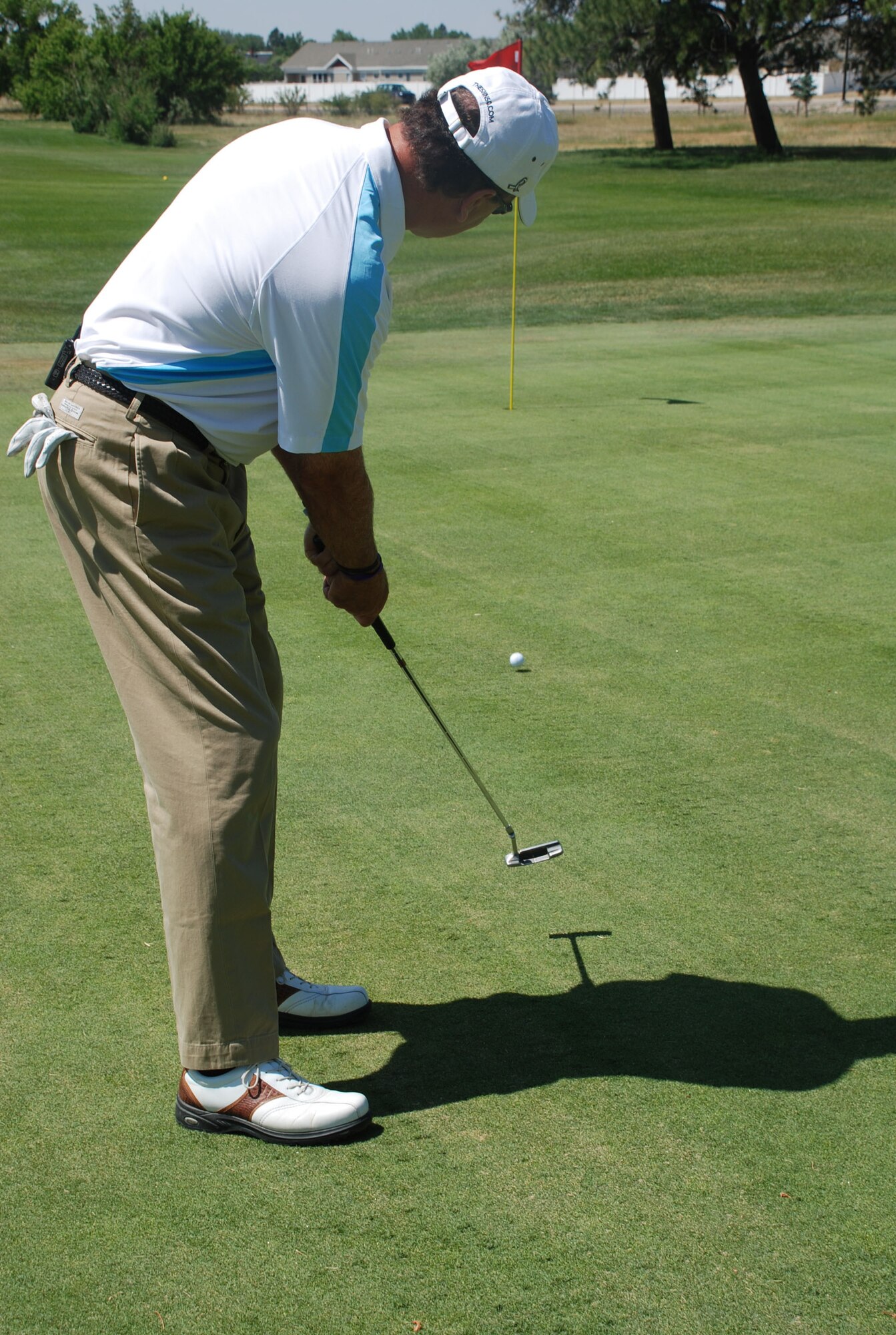 Bill Evans, Atlanta golfer, 50 in 50 co-founder, putts during a round of golf July 15 at the base golf course. Mr. Evans and Craig Forney, PGA golf professional, visited Warren as part of a nation-wide fundraising event supporting cancer research and prevention (Photo by Senior Airman Connor Burkhard).