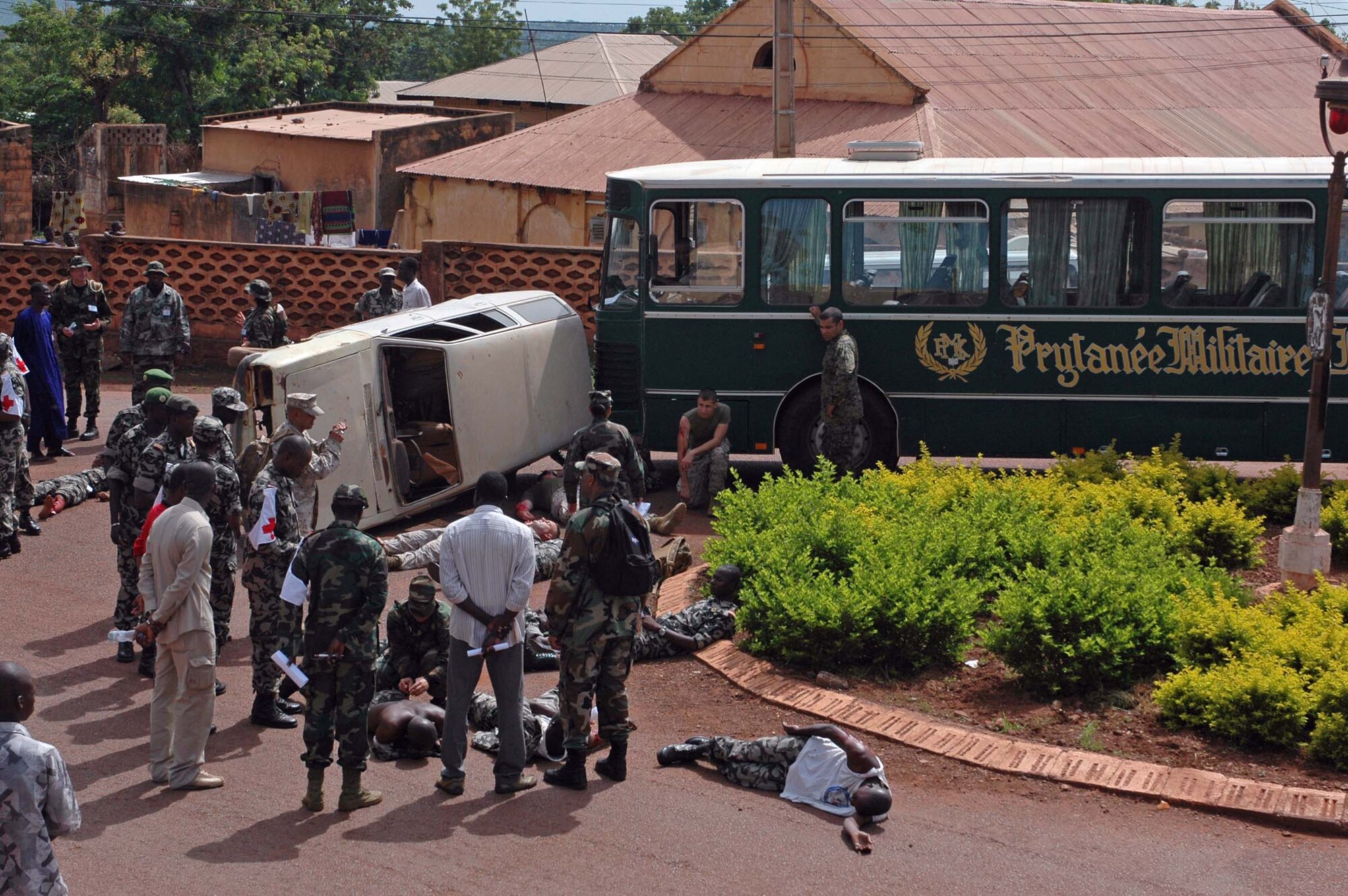 BAMAKO, Mali -- Malian medics, doctors and nurses put their skills to the test during their first-ever mass casualty exercise July 18, 2008, in the village of Kati. 
Medics received a call late Friday morning of a simulated bus crash -- with an actual bus and a vehicle on its side, blocking a roundabout. The mass casualty scenario is part of MEDFLAG 08, a multi-national medical training exercise designed to enhance medical capabilities and readiness for U.S. and African forces. (U.S. Air Force photo/Senior Airman Justin Weaver)
