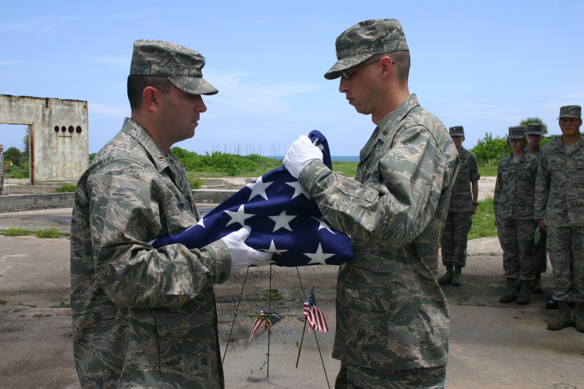 Chaplain candidates take part in a memorial service July 15, 2008, at Pad 34 Apollo Saturn. The pad is the site of the Jan. 27, 1967, tragic flash fire that took the lives of three astronauts during a launch pad test of the Apollo/Saturn space vehicle preparing for the first piloted flight, the AS-204 mission. The candidates began a 28-day tour of military bases in the Southeast on July 14 to learn more about missions supported by the Air Force. (U.S. Air Force photo/Capt. Tricia Hill)