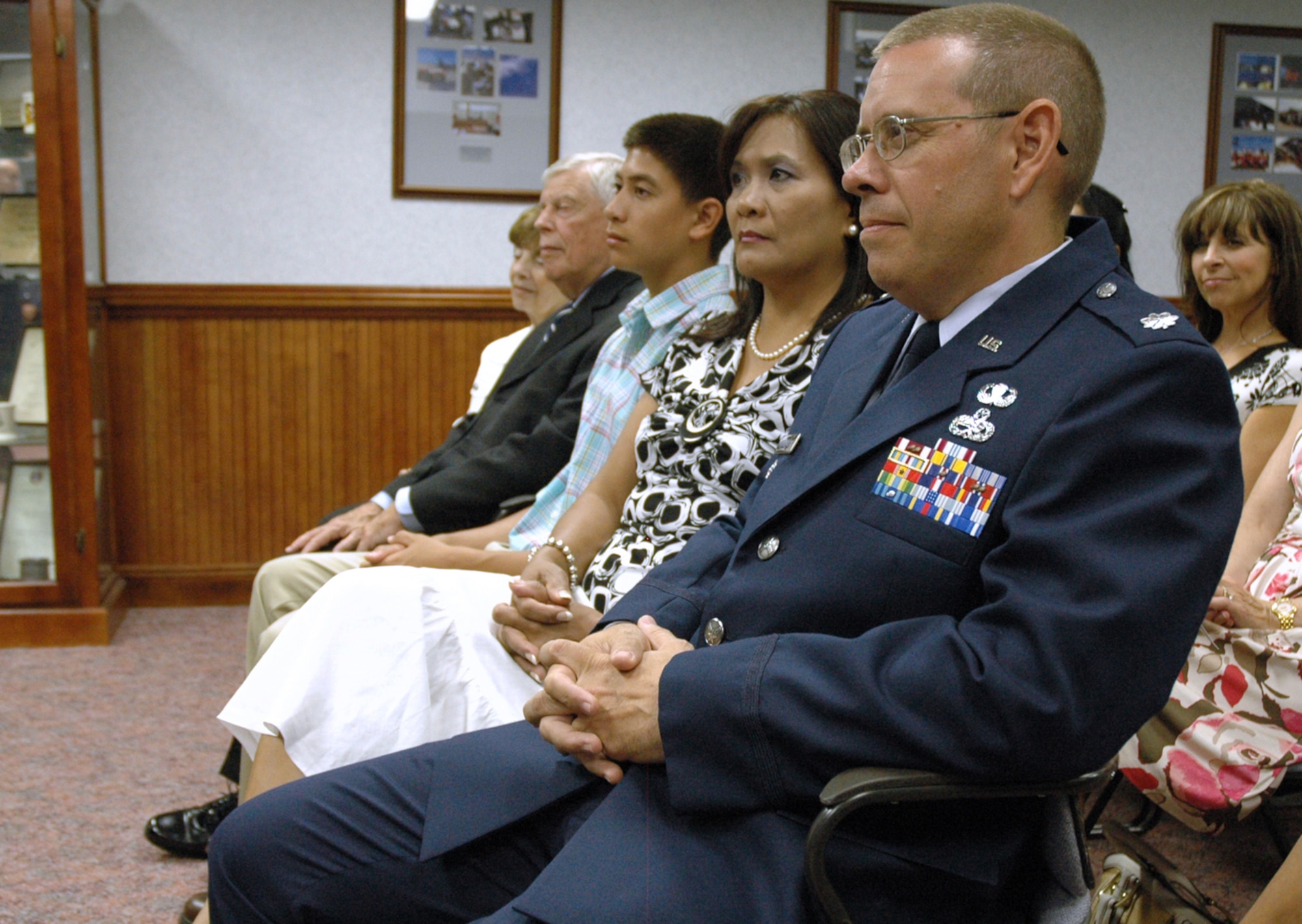 EGLIN AIR FORCE BASE, Fla. -- Lt. Col. Charles Cunningham, Aircraft Maintenance Advisor, HQ Iraqi Air Force, sits with family before being presented with the Bronze Star Medal for meritorious achievements made during his recent deployment. (US Air Force photo/ Airman 1st Class Anthony Jennings)