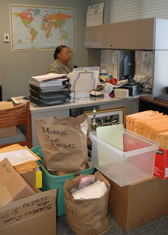 Maser Sergeant Darcell Smith, 81st Aerial Port Squadron, Command Support Staff NCOIC, is surrounded with paperwork related to the upcoming ORI.  After running out of space on her desk she has resorted to piling paperwork wherever she can. (U.S. Air Force photo by Tanya Trejo)