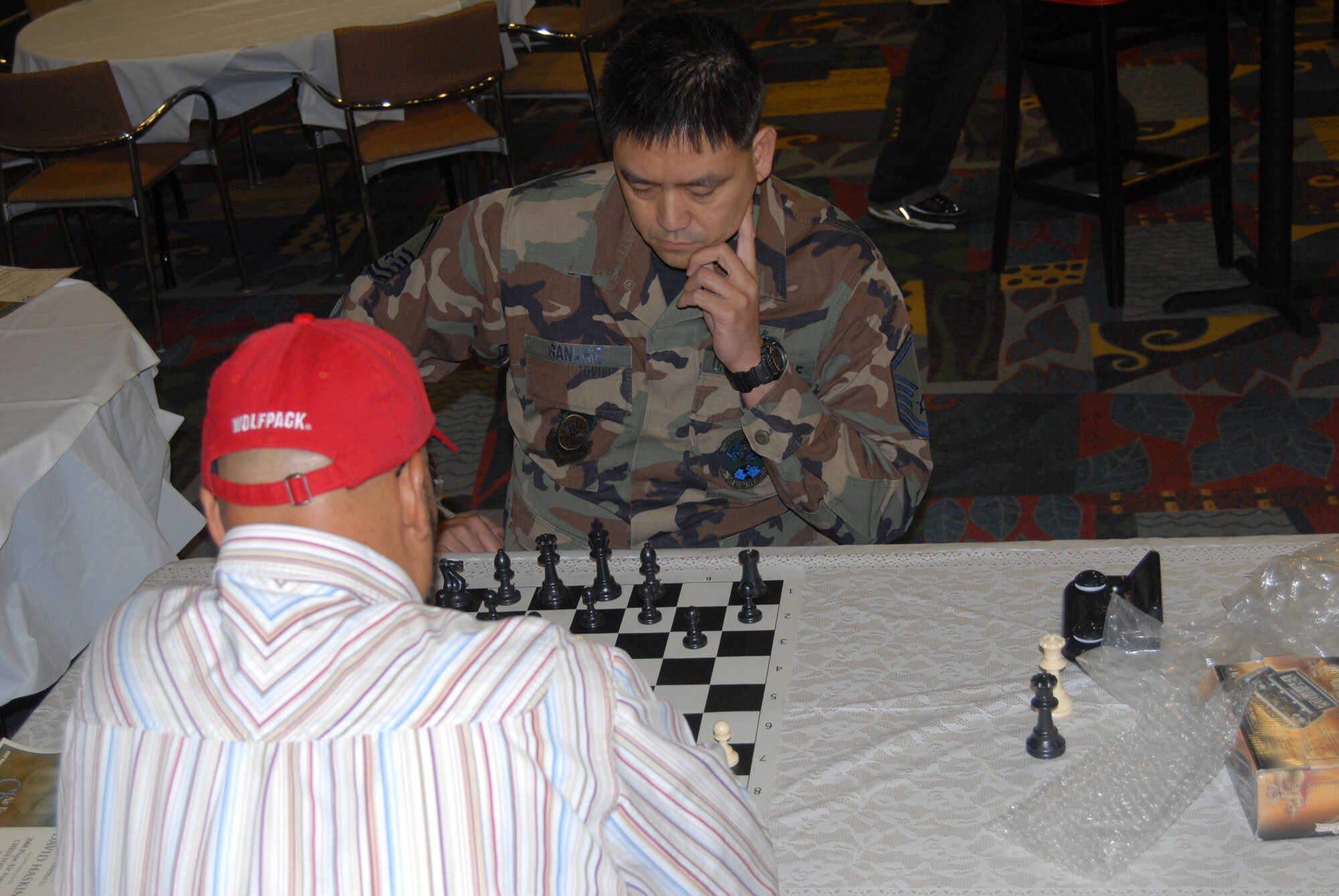 Master Sgt. Dan Ranario, 3rd Aerial Port Squadron, contemplates his next move during the Pope chess tournament at the community activities center in March. Sergeant Ranario competes in the 19th North Atlantic Treaty Organization Chess Championship Aug. 4 through 8 as a member of the U.S. chess team. He has been playing chess since he was 10 years old. This year’s U.S. chess team will travel to Brussels, Belgium to compete. (U.S. Air Force Photo by Airman 1st Class Mindy Bloem)