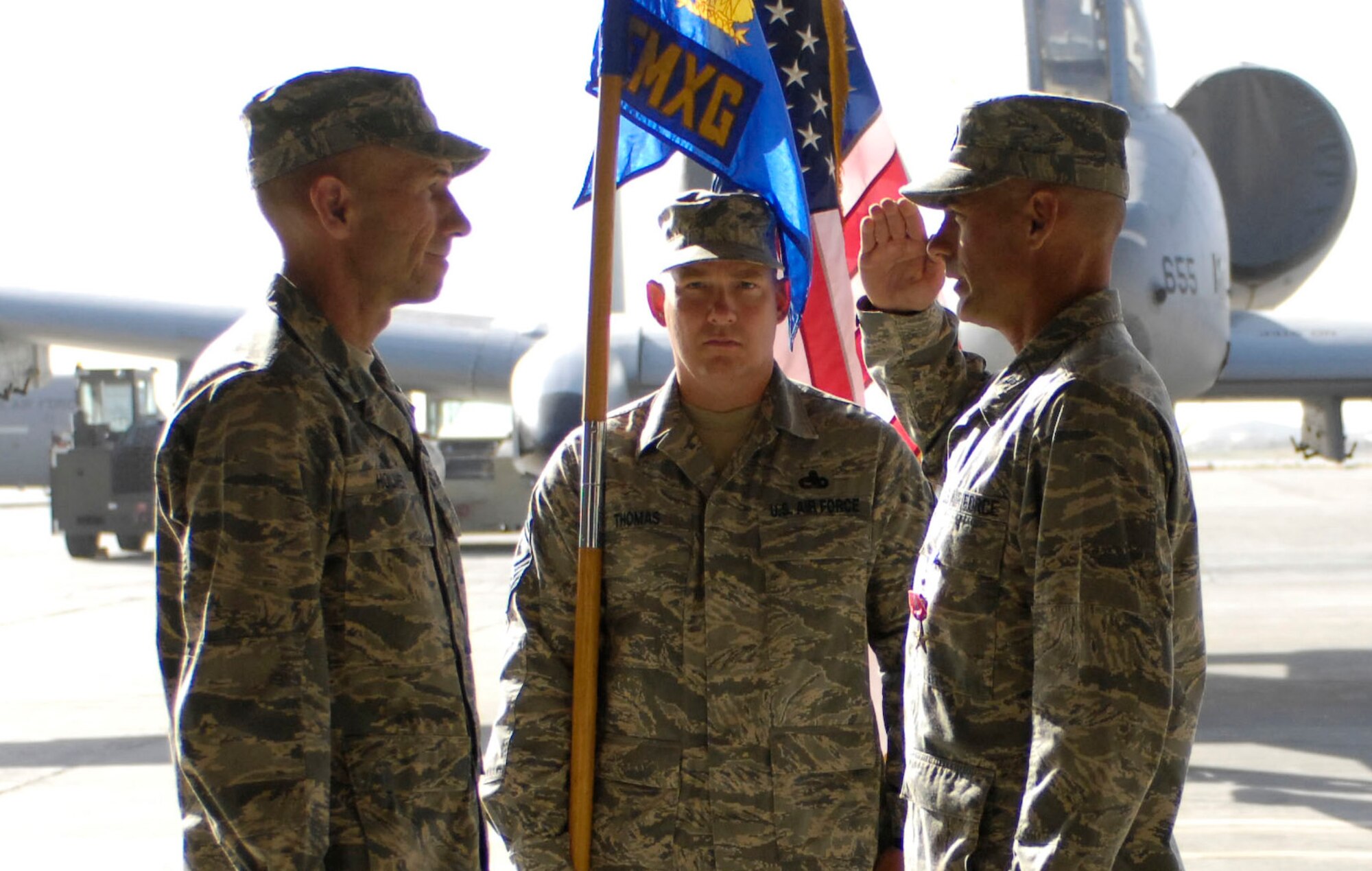 BAGRAM AIR FIELD, Afghanistan -- Col. Jon Sutterfield (right) notifies Brig. Gen. Mike Holmes, 455th Air Expeditionary Wing commander, that he relinquishes command of the 455th Expeditionary Maintenance Group during a ceremony here July 17, 2008. Col. Clifton Blanks assumed command from Colonel Sutterfield, who had served as commander since Aug. 8, 2007. (U.S. Air Force photo by Staff Sgt. Rachel Martinez)
